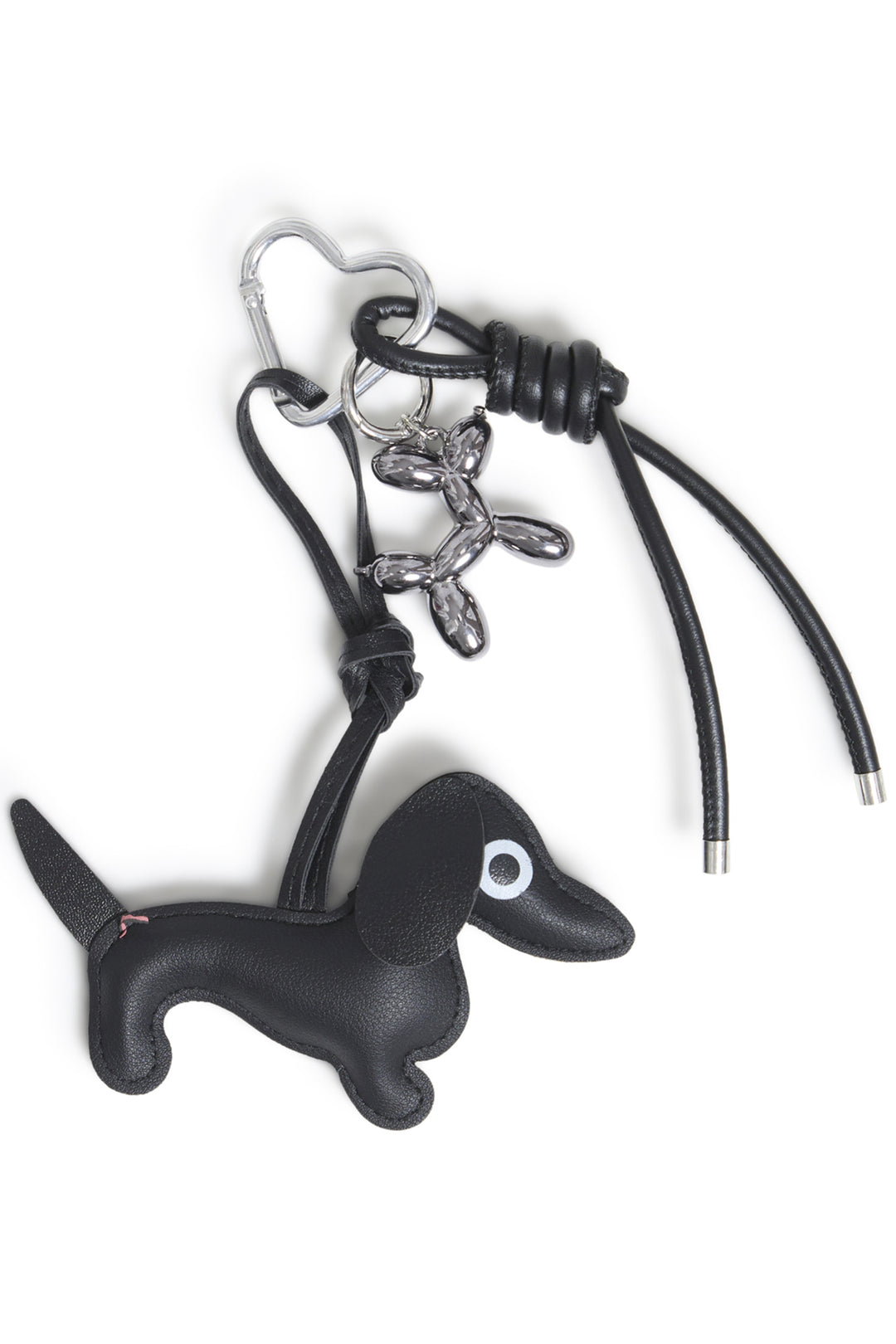 A black dog bag charm shown against a white background. 