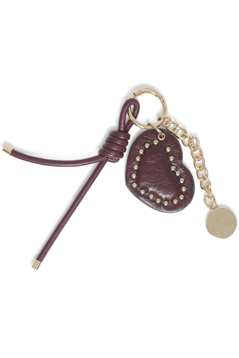A brown heart bag charm shown in front of a white background. 