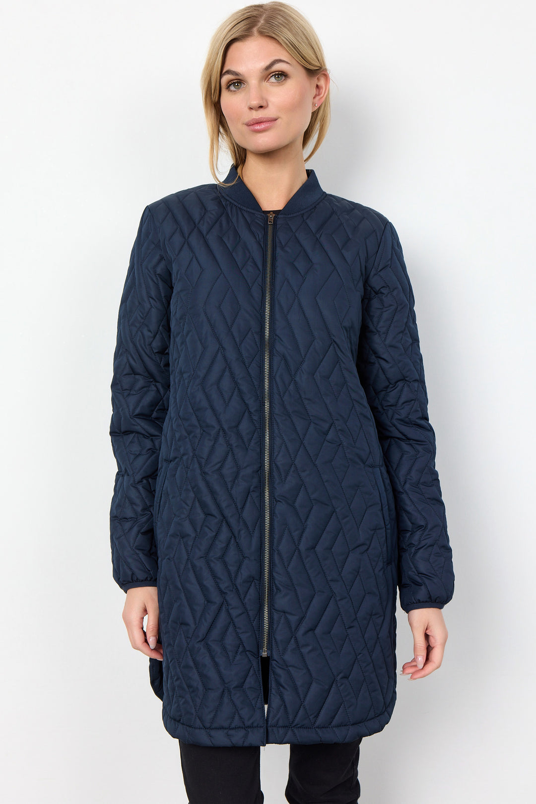 Soya Concept Fall 2024 eaturing high-quality quilted polyester and a longer fit, this jacket boasts style and comfort. With a zipper closure and two front pockets, you'll feel warm and secure no matter where you go!