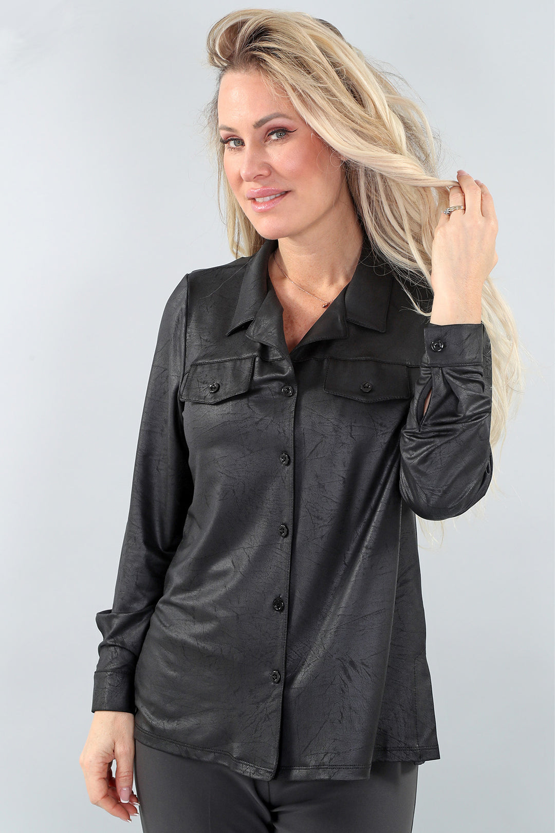 Michael Tyler Fall 2024  This sleek blouse-like shirt features two breast pockets and full buttons for a classic look. The neat crinkle design adds a unique touch, while the cuff buttons and classic collar elevate the overall look. 