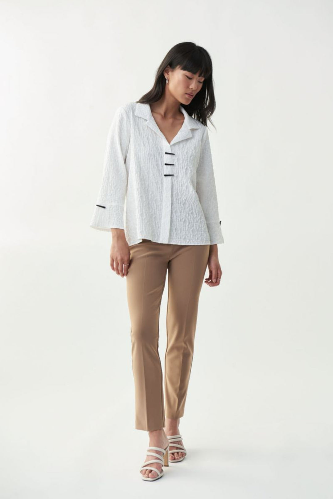 Joseph Ribkoff Fall 2024 The Willow Aankle Pant boasts a sleek and slim design, perfect for pairing with blouses and loose tops.