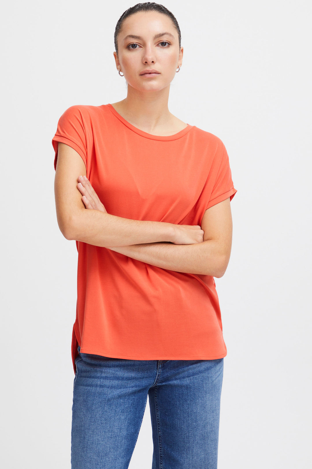 With its cap short sleeves and looser fit, this top offers both style and comfort.