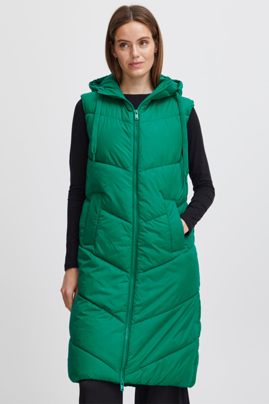 Crafted from a soft woven fabric and featuring a regular fit, sleeveless design, drawstring hood and a below the knee full front zip, this vest is sure to provide comfort and protection.