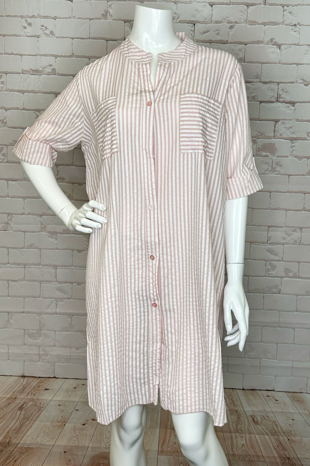 With a light and airy feel, front button closure and relaxed fit, this dress will become your go-to casual house dress! 