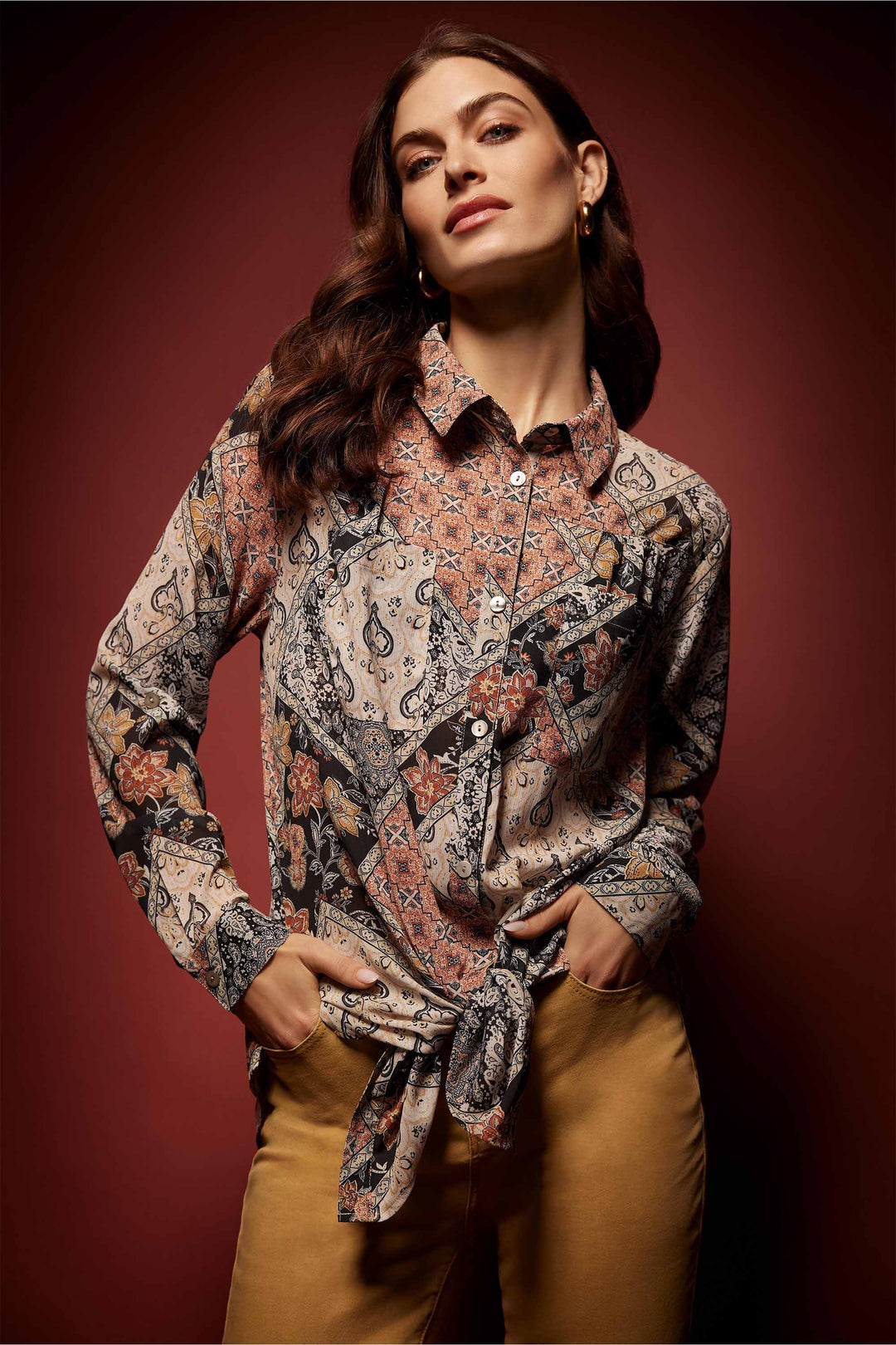 Charlie B Fall 2024 This patchwork design is so cute and brings a retro feel to a classic shirt! It has a button up front, a classic collar and front chest pockets.