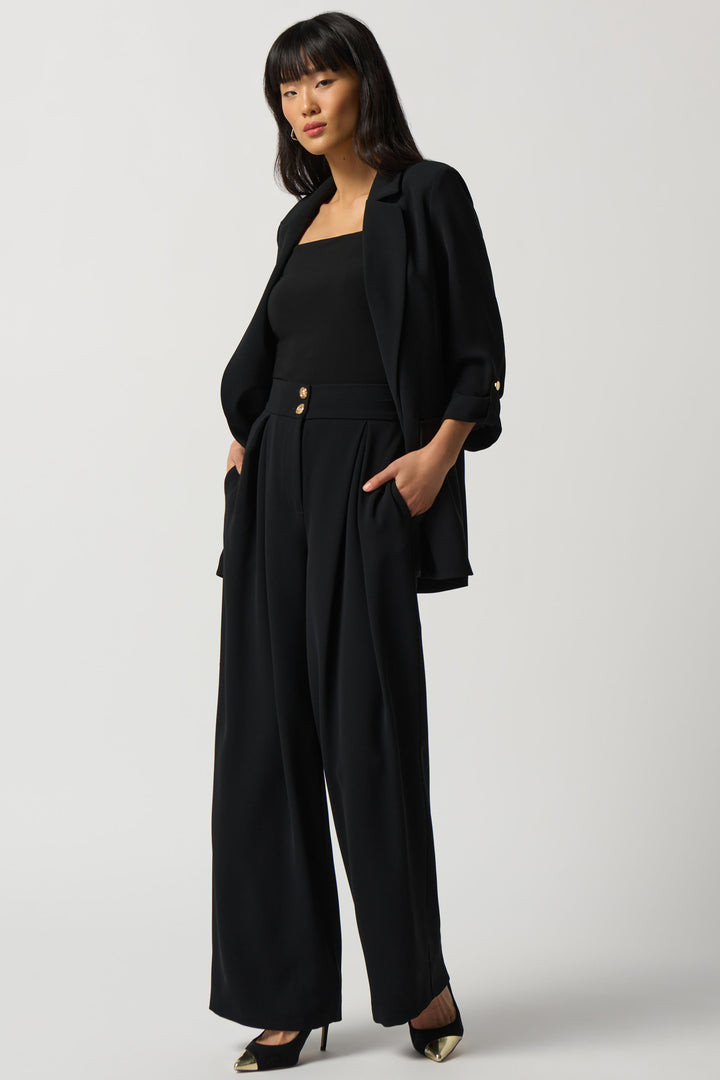 Featuring a sophisticated front opening waistband with belt loops, sleek side pockets and an elegant wide leg, these pants offer a luxurious touch to all your ensembles.