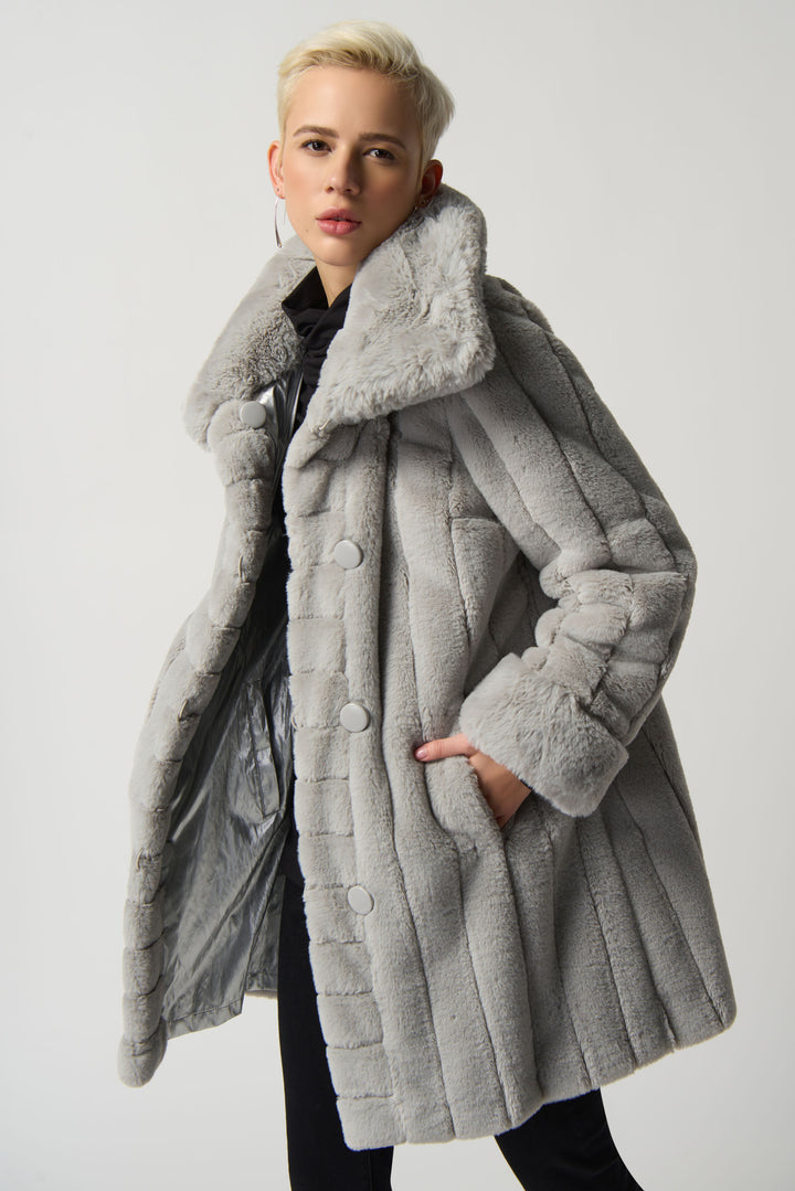 Crafted from premium faux fur for a luxuriously soft feel, the coat has full length puff sleeves and a plush fabric that you'll love to wrap up in.