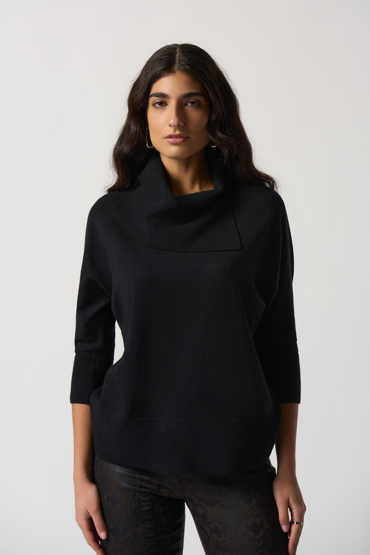 This standout sweater features 3/4 dolman sleeves and a distinctive asymmetrical cowl neckline crafted with sweater knit fabric. 