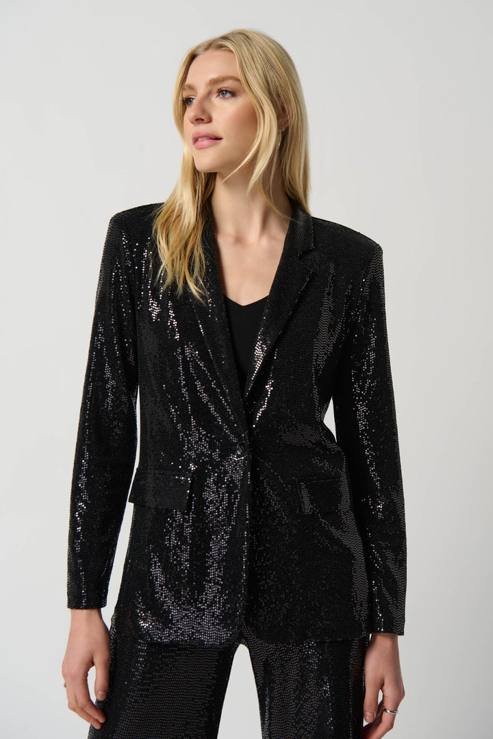 It's designed to provide an elegant, structured fit, with a longer hemline and two side pockets. The blazer is adorned with dazzling shiny sequins, perfect for making a stunning statement at any event.