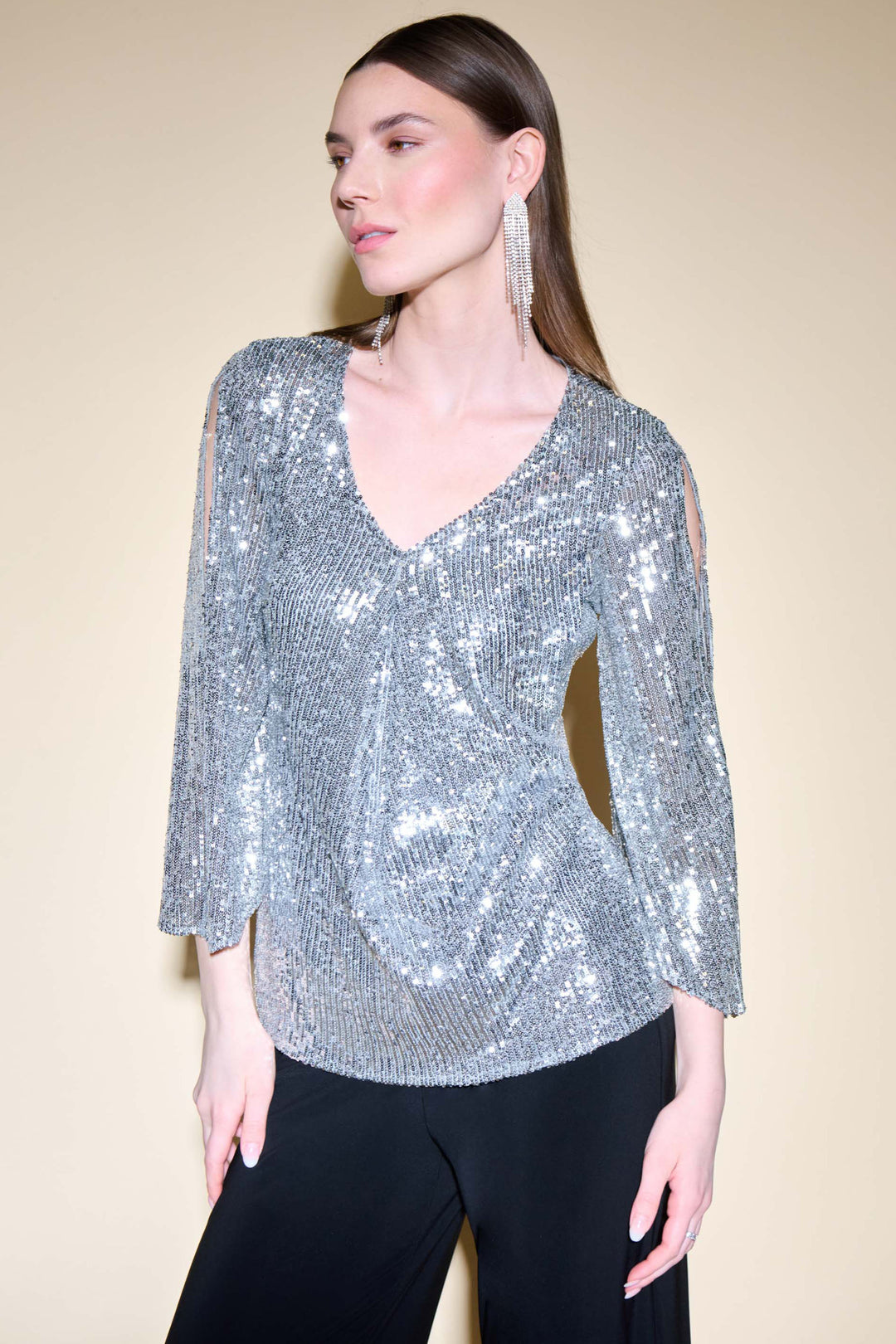 With a v-neck and wide bell sleeves for added elegance, it is the perfect statement piece. 