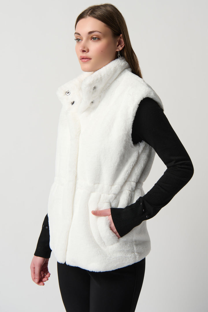 Boasting a mock neck and front pockets in luxurious faux fur, this bold vest isn't for the faint of heart. 
