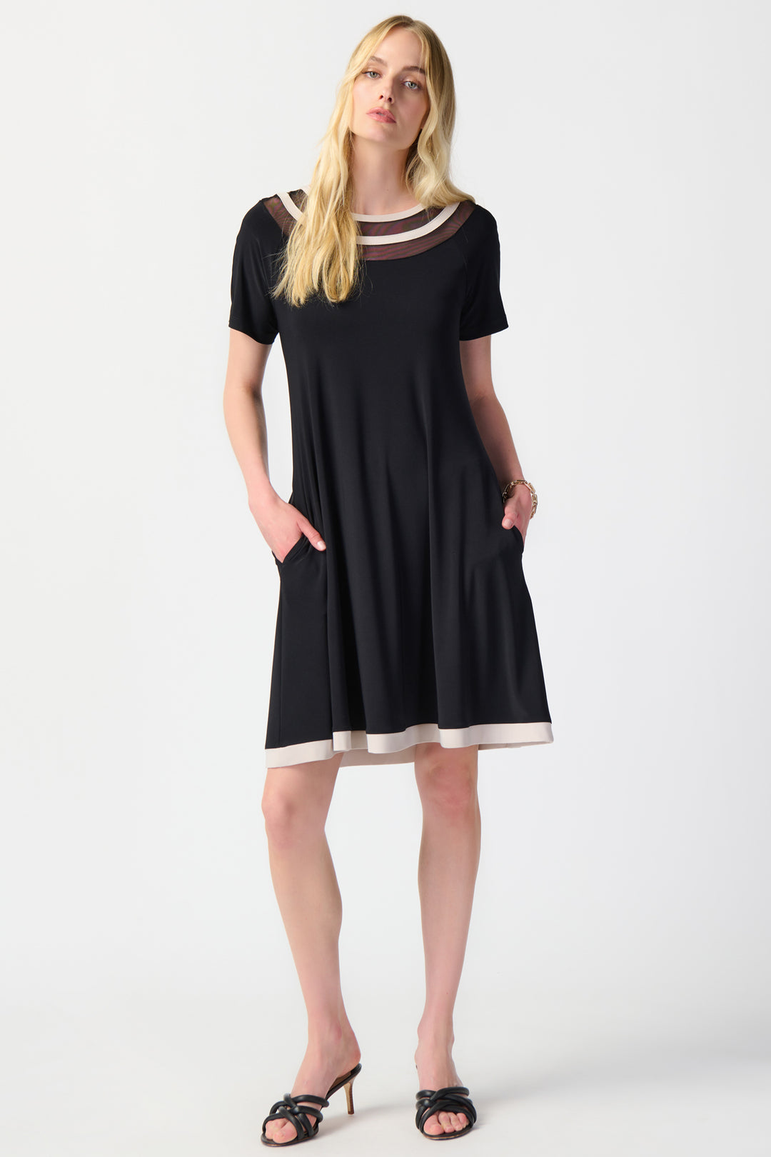 This dress is designed with a casual flow and showcases stylish contrast border hem and neckline. 