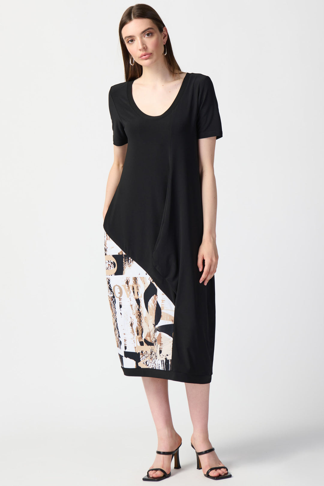 This bold yet simple Cocoon Dress features a relaxed fit, midi-length and round neck design
