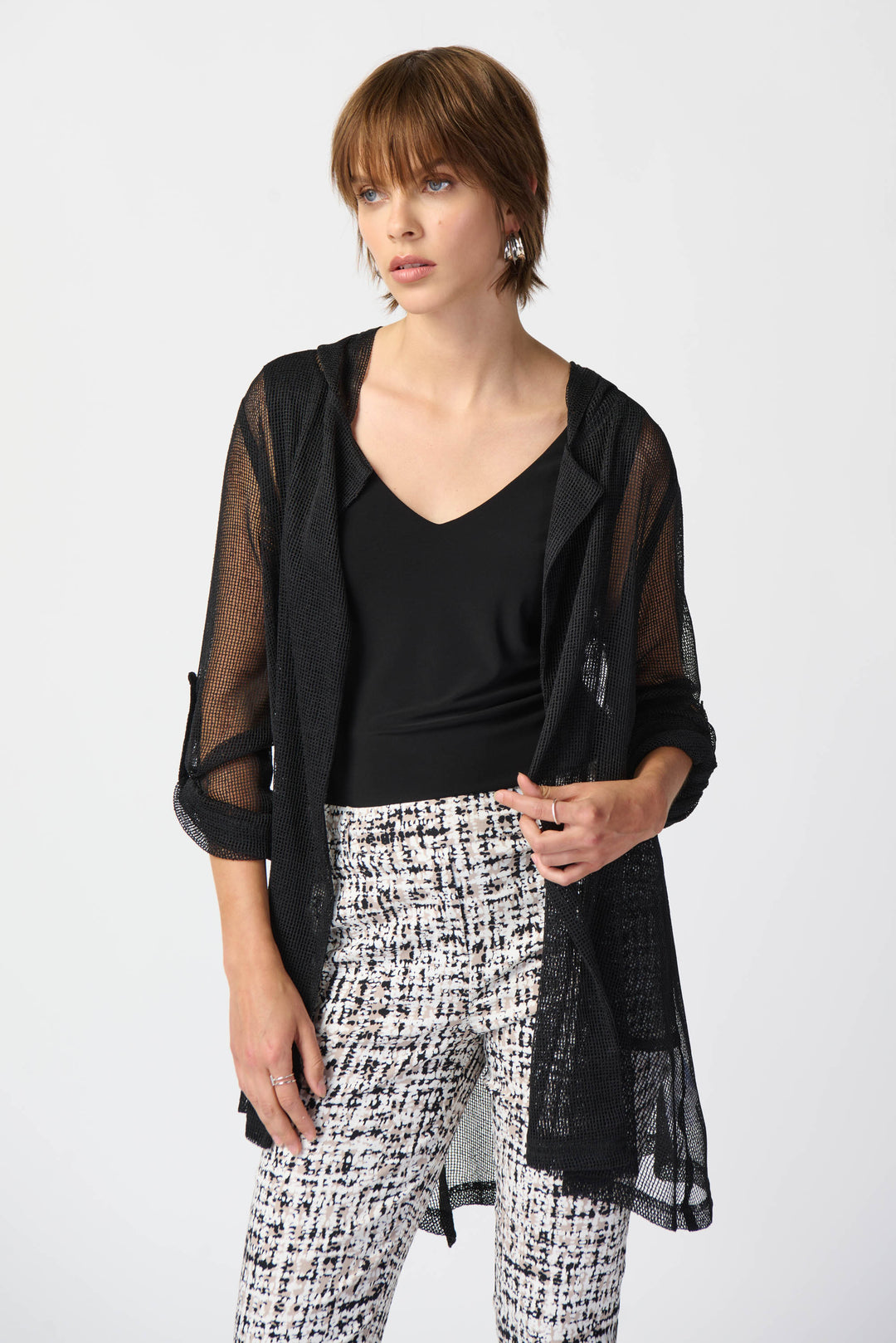 This super light and free flowing 'fishnet' cardigan is perfect for adding a touch of edginess to any outfit. 