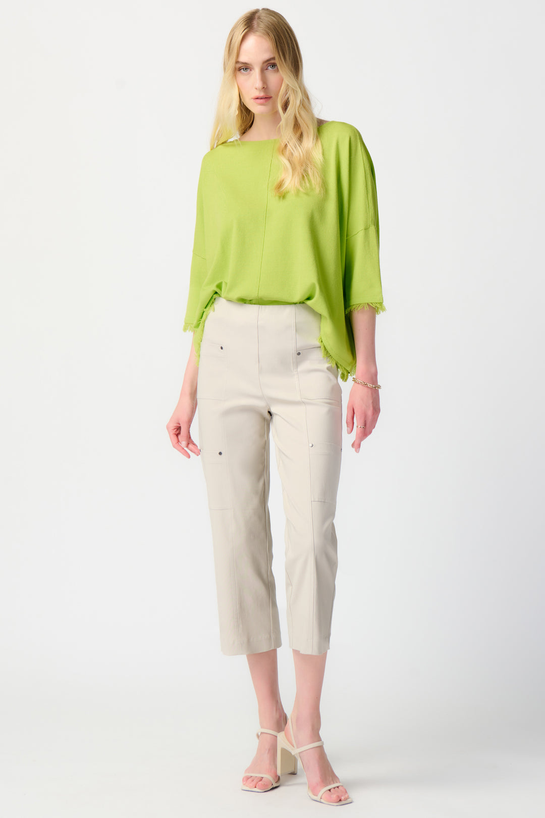 Joseph Ribkoff Summer 2024  With a high waist fit and cargo style, this pant can easily be dressed up or down for any occasion. 