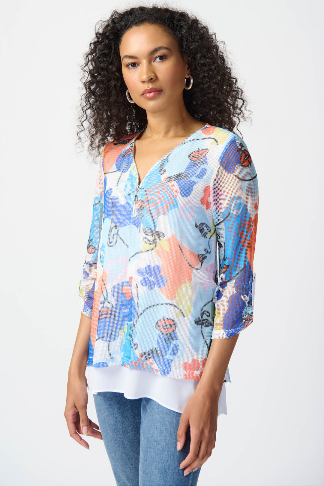 Made with light and airy mesh fabric, it boasts a beautiful abstract print with flowers all-over. 