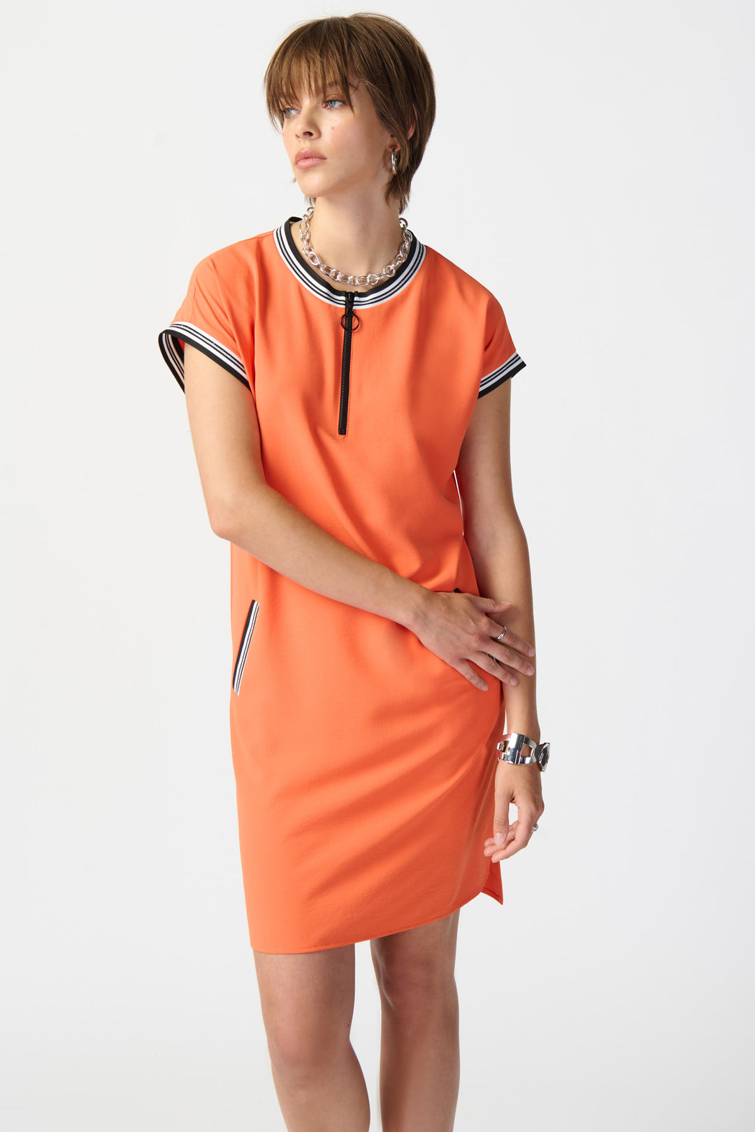  JOSEPH RIBKOFF Spring 2024 The light and relaxed fabric, combined with the quarter front zipper and contrast <span data-mce-fragment="1">striped </span>detailing at the neckline and cuffs, adds a touch of sophistication. 
