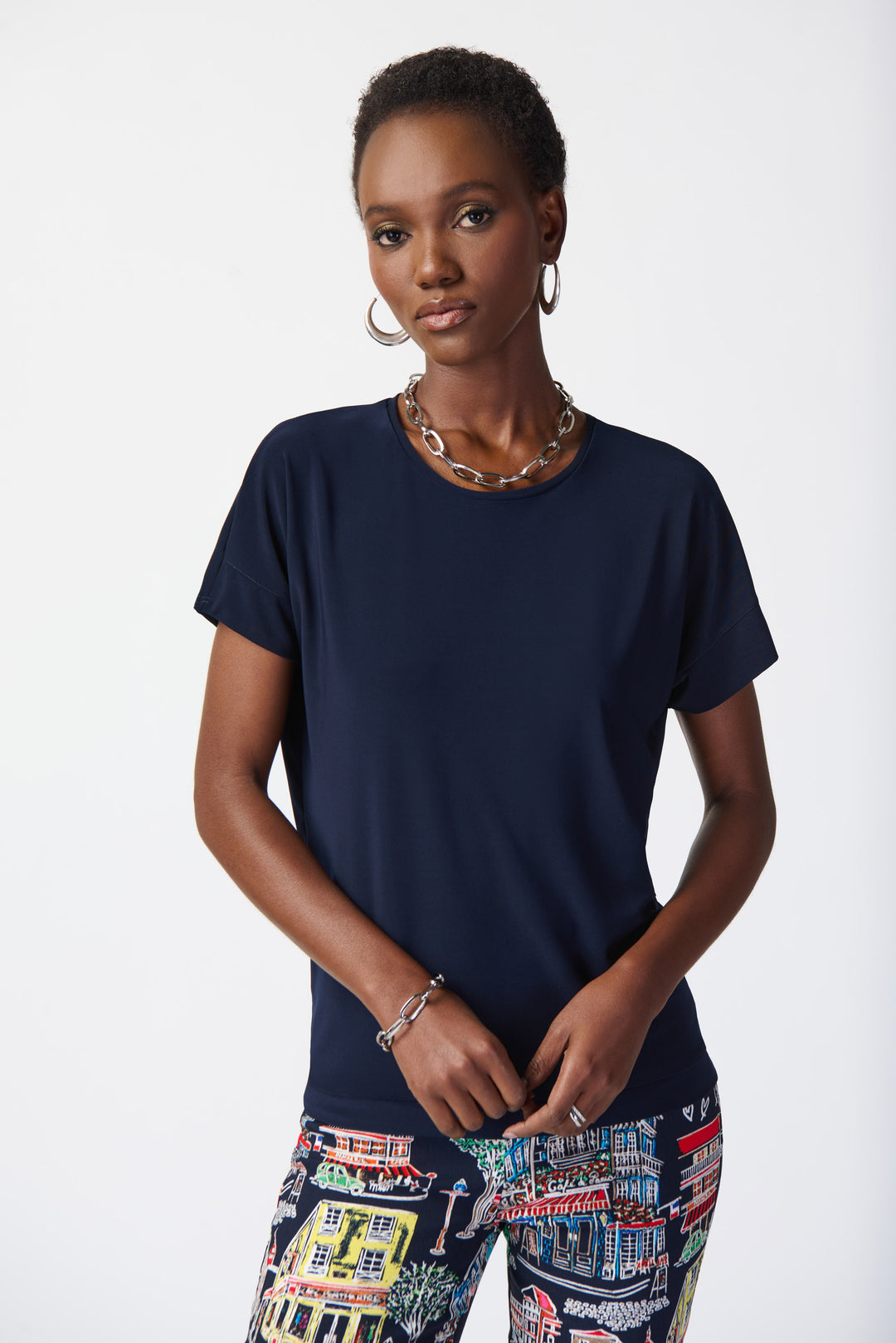 This classic t-neck design, featuring a roundneck and soft, smooth fabric, is perfect for any occasion.