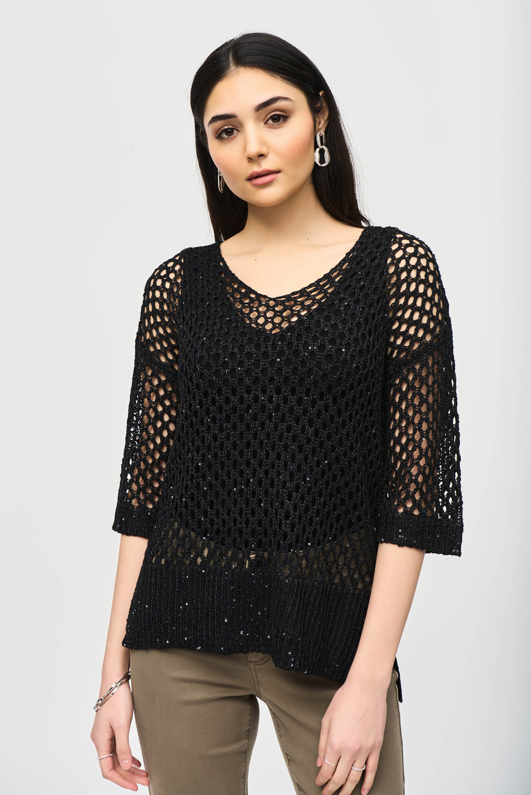 Joseph Ribkoff Fall 2024 The light v-neck and contrasting cuffs and hem add a touch of elegance. Its lace-style design and thick mesh fabric exude sophistication.