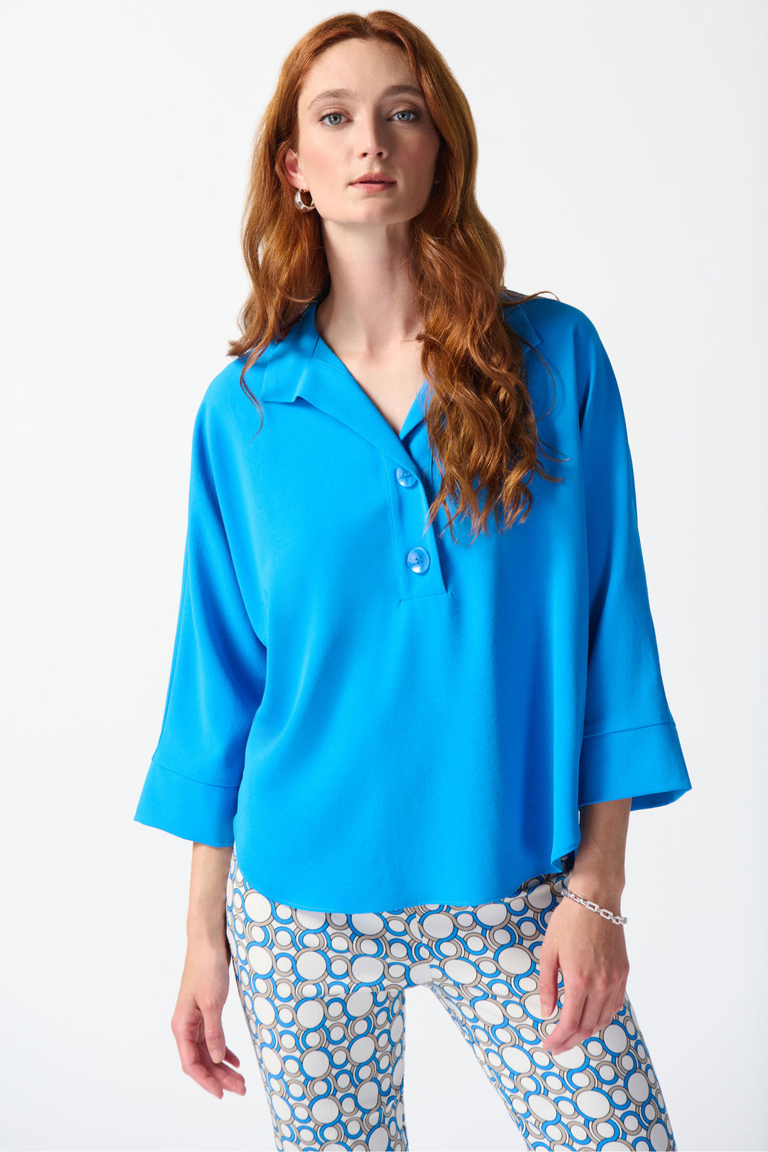 JOSEPH RIBKOFF Spring 2024 Featuring 2 bold front buttons and a relaxed fit, this top exudes effortless style. 