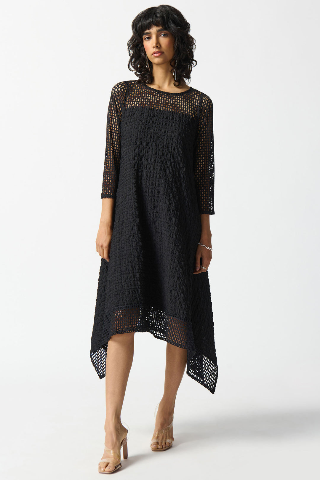 Joseph Ribkoff Summer 2024 The graceful handkerchief hemline and lace overlay offer an airy and relaxed fit, perfect for those who like to take light chances.