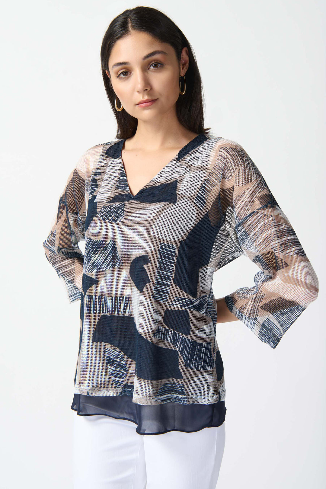 JOSEPH RIBKOFF Spring 2024 With a sleek silhouette and smart v-neck, this top effortlessly combines style and comfort.