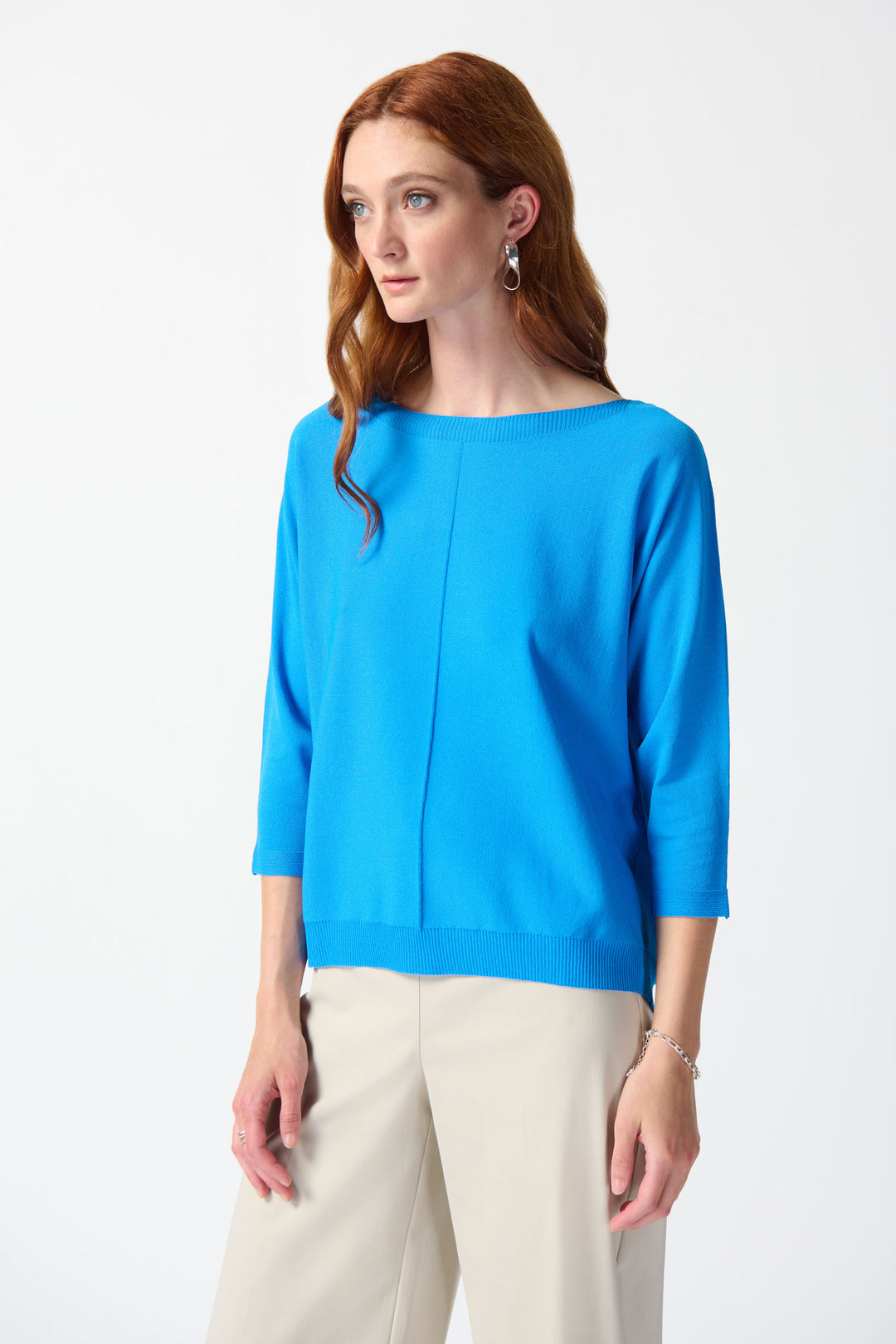 Designed with a relaxed fit and 3/4 length dolman sleeves, this polished piece will elevate any spring and summer outfit.