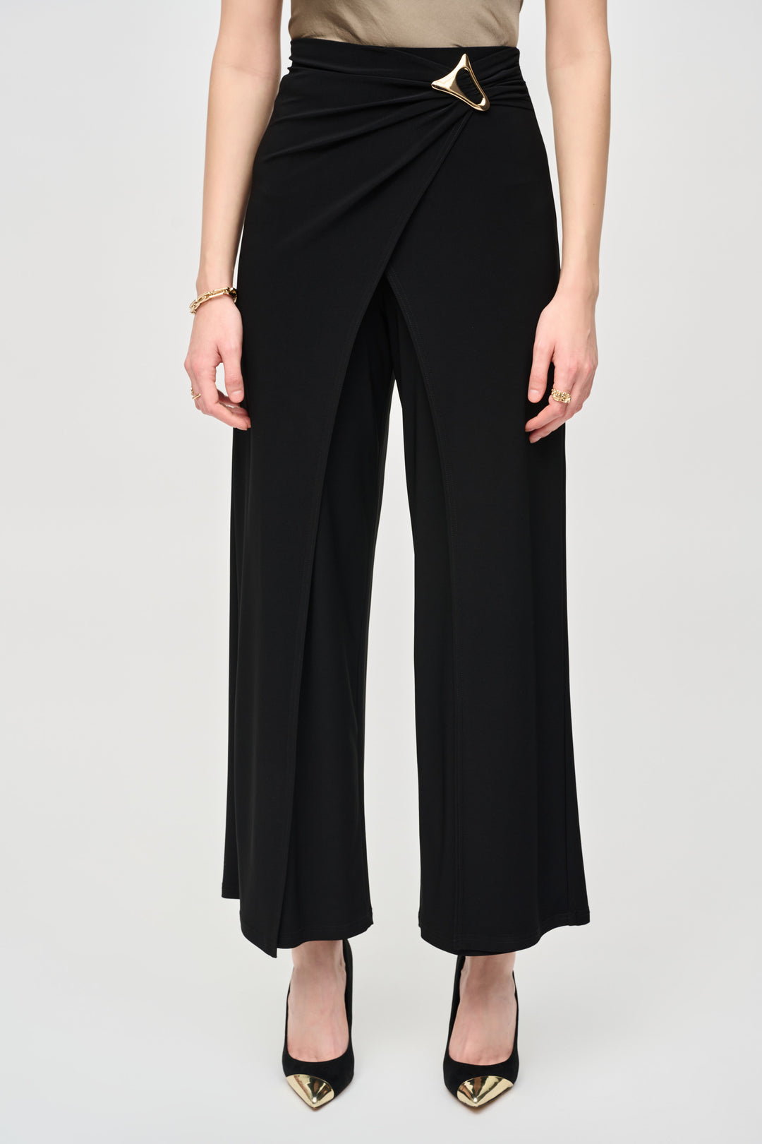 Joseph Ribkoff Fall 2024  The high-rise waist and wrap design adds a unique twist to traditional dress pants, while the free-flowing cut adds movement and grace to your ensemble. 