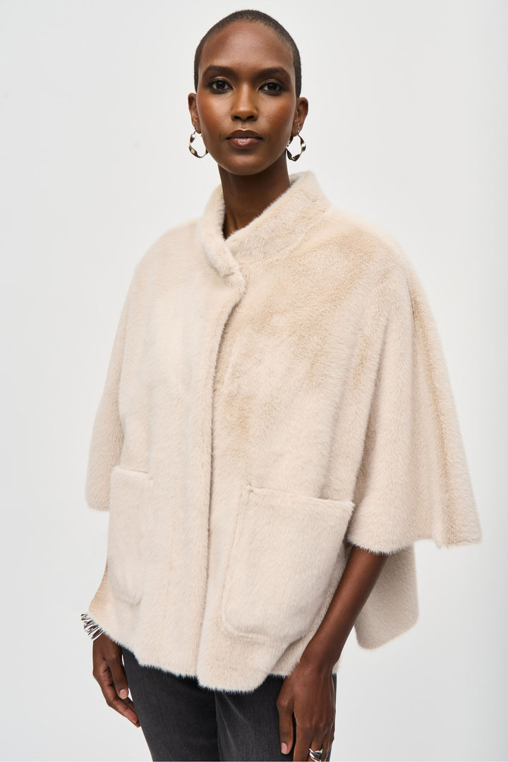 Joseph Ribkoff Fall 2024 The mock neck and woven suede provide warmth and comfort, while the 3/4 length dolman sleeves add a touch of elegance.