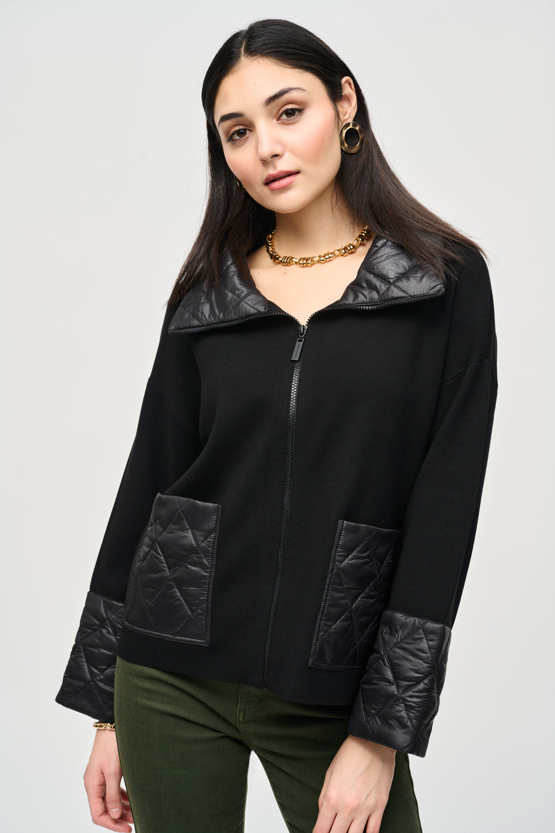 Joseph Ribkoff Fall 2024 This sweater style jacket features a high mock collar, front zipper and quilted large front pockets, all designed to keep you stylish and warm. 