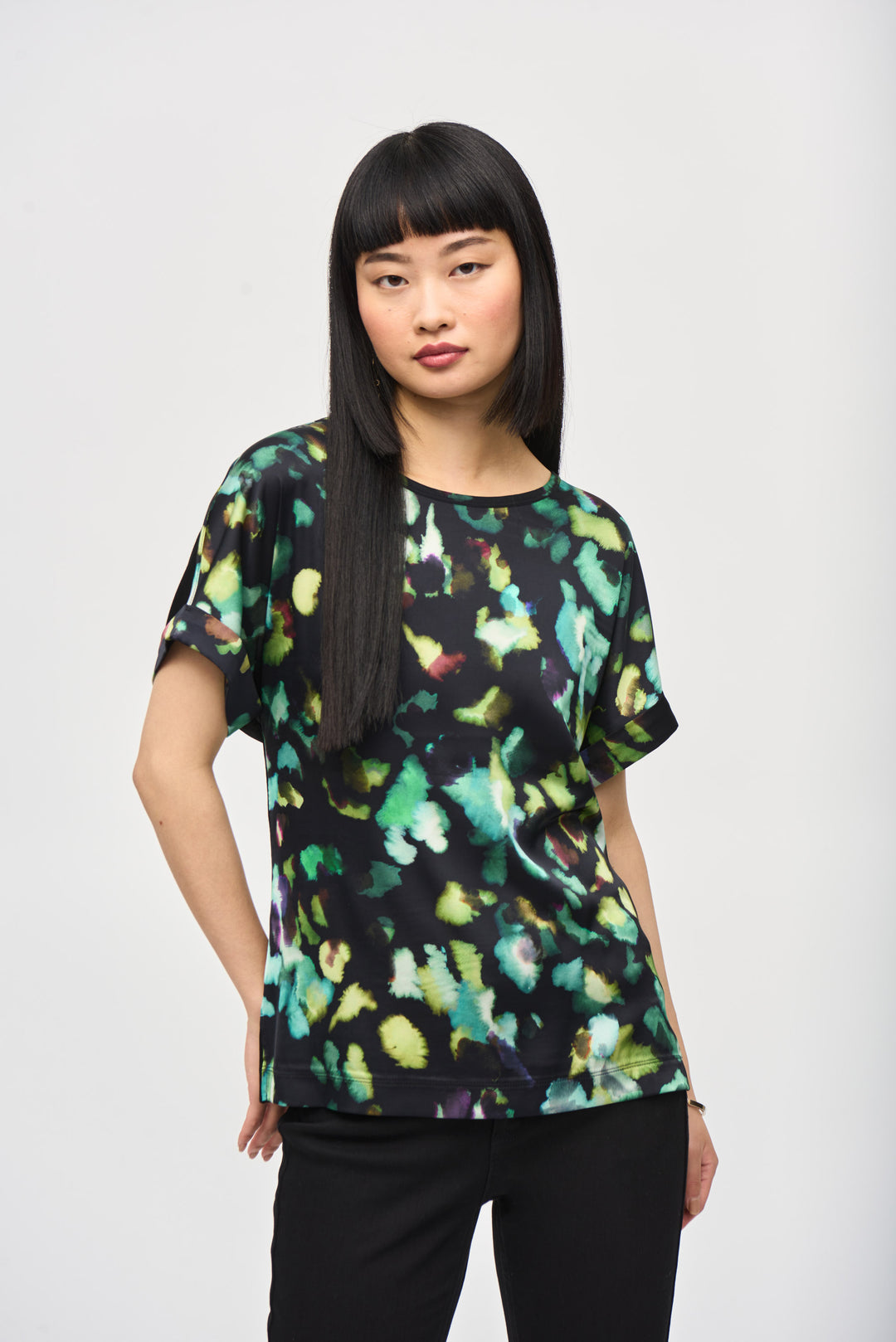Joseph Ribkoff Fall 2024 Featuring a vivid design pattern in the front, light and soft fabric and contrast cuffs and neckline, this fall top is perfect for a fun and laid-back look.