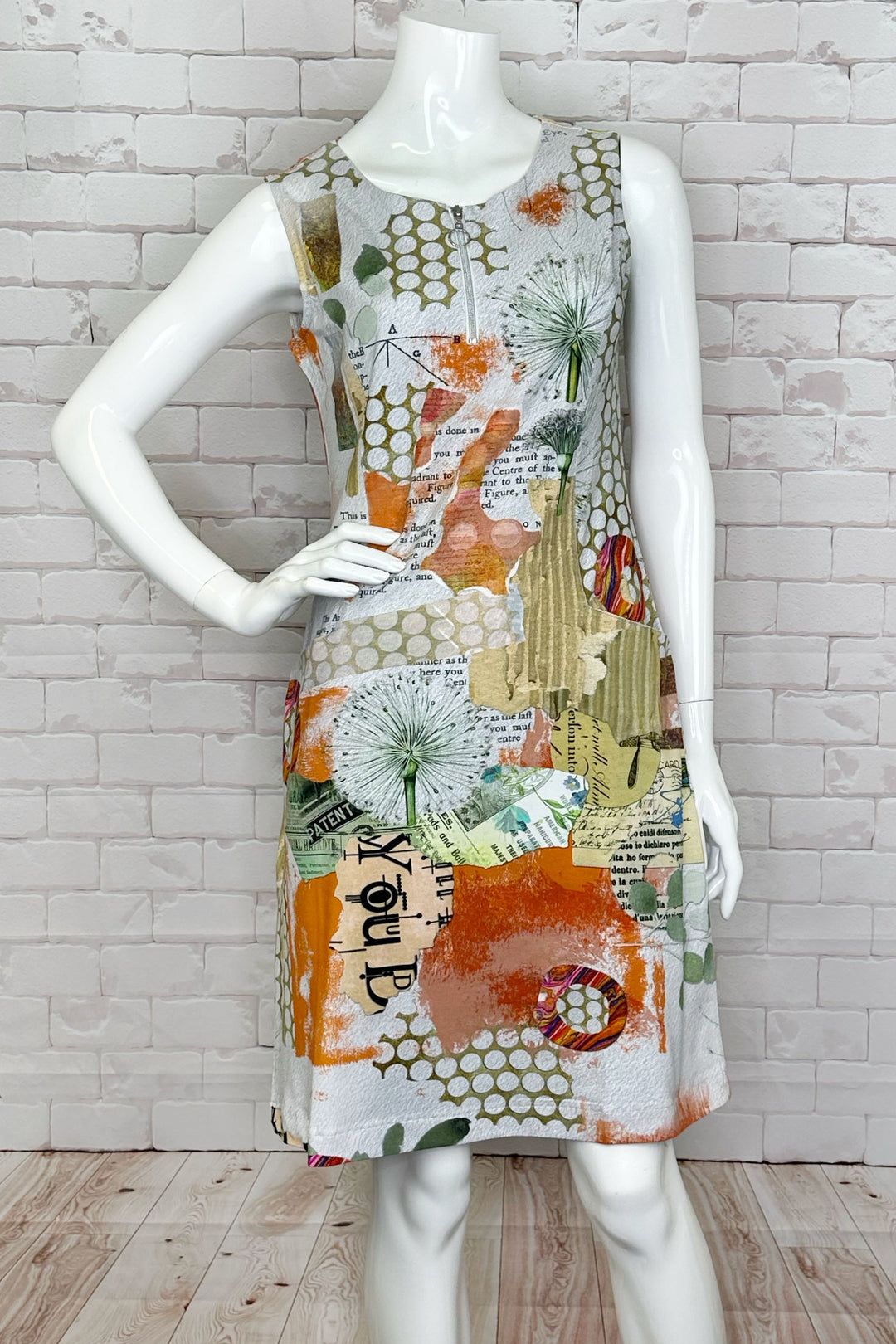 Dolcezza Spring 2024 With the colourful orange print, sleeveless style, quarter zipper front, boat neckline creates a flattering and feminine silhouette.