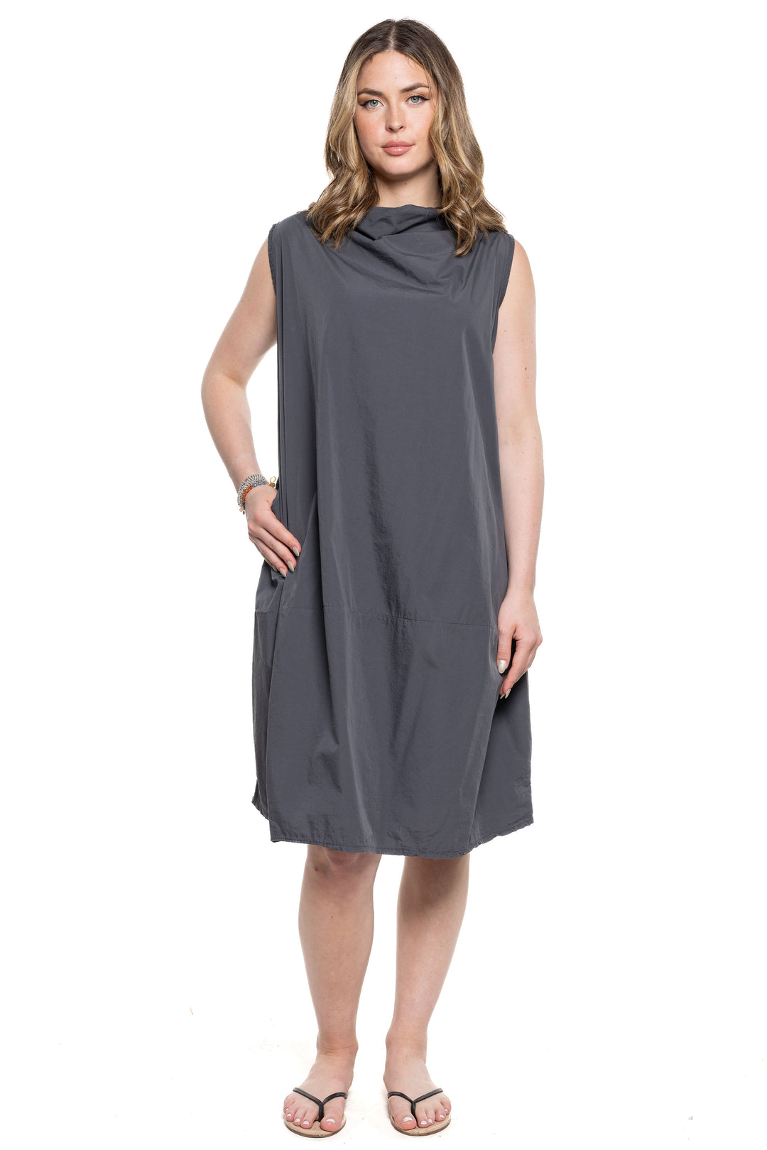 Etern Elle Summer 2024 The soft balloon shape and drape cowl neck add a touch of elegance, while the relaxed fit and side pockets provide comfort and convenience.