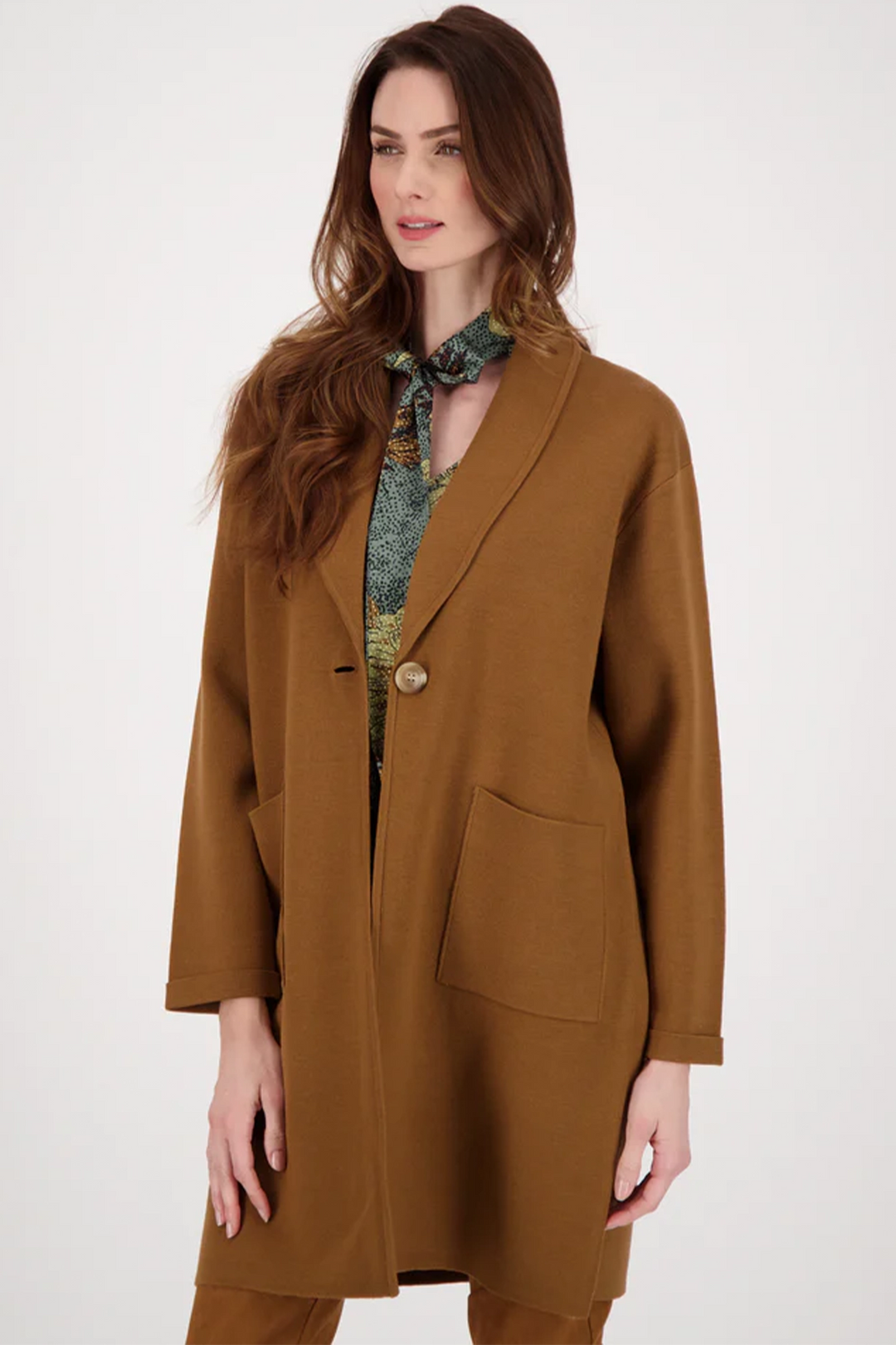 This snug coat has a relaxed fit that adds a formal twist to any casual look.