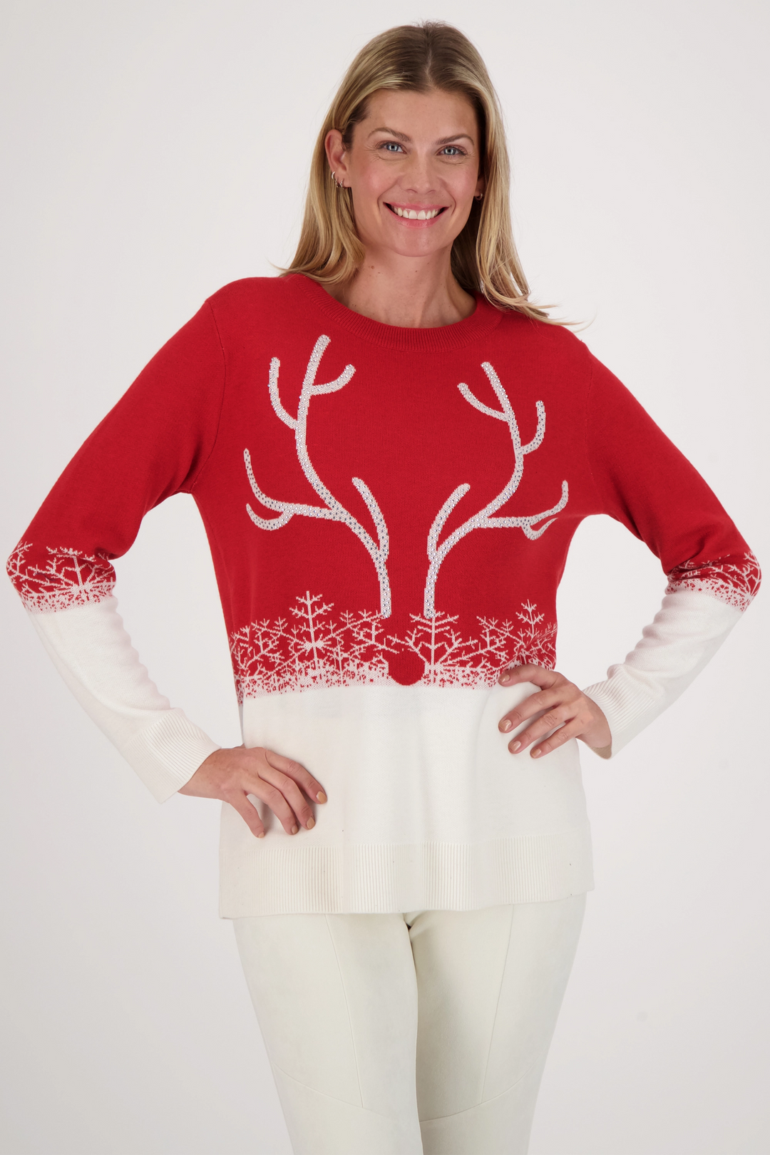 It is a festive light sweater with a colour contrast of red and snowy white, full length sleeves and a cute reindeer with a red nose! 