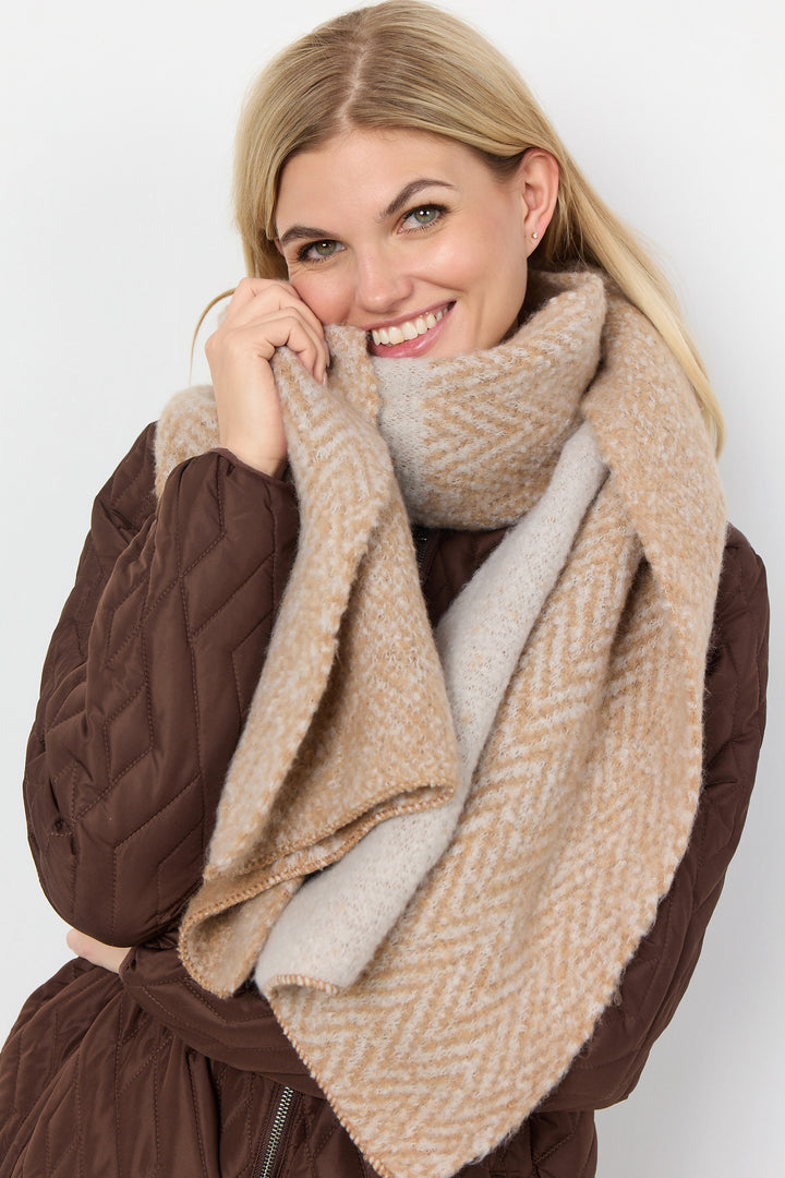 Accessorize your wardrobe with this soft and lighweight Chevron Scarf. This rectangular scarf features classic fall colours to perfectly complement your look.