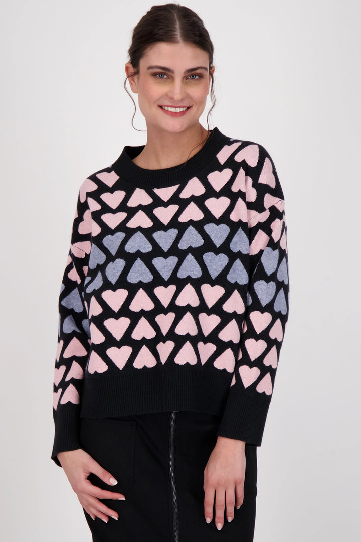 Enjoy feeling cozy with the all-over hearts and ribbed collar, hem and cuffs. Perfect for both day and night, this lovely long sleeve light sweater is the must-have for this holiday season.