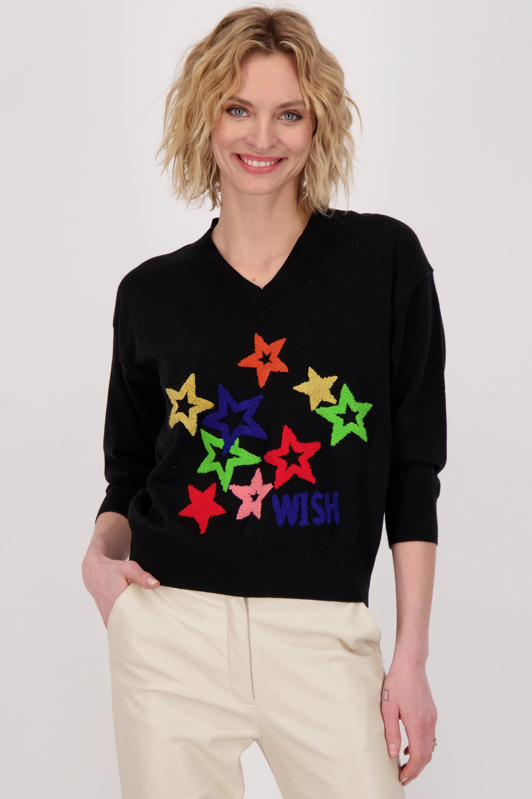 This v-neck sweater is comfy and decorated with colourful stars and a 'Wish' print on the front, making it the perfect item for any night of stargazing this season.