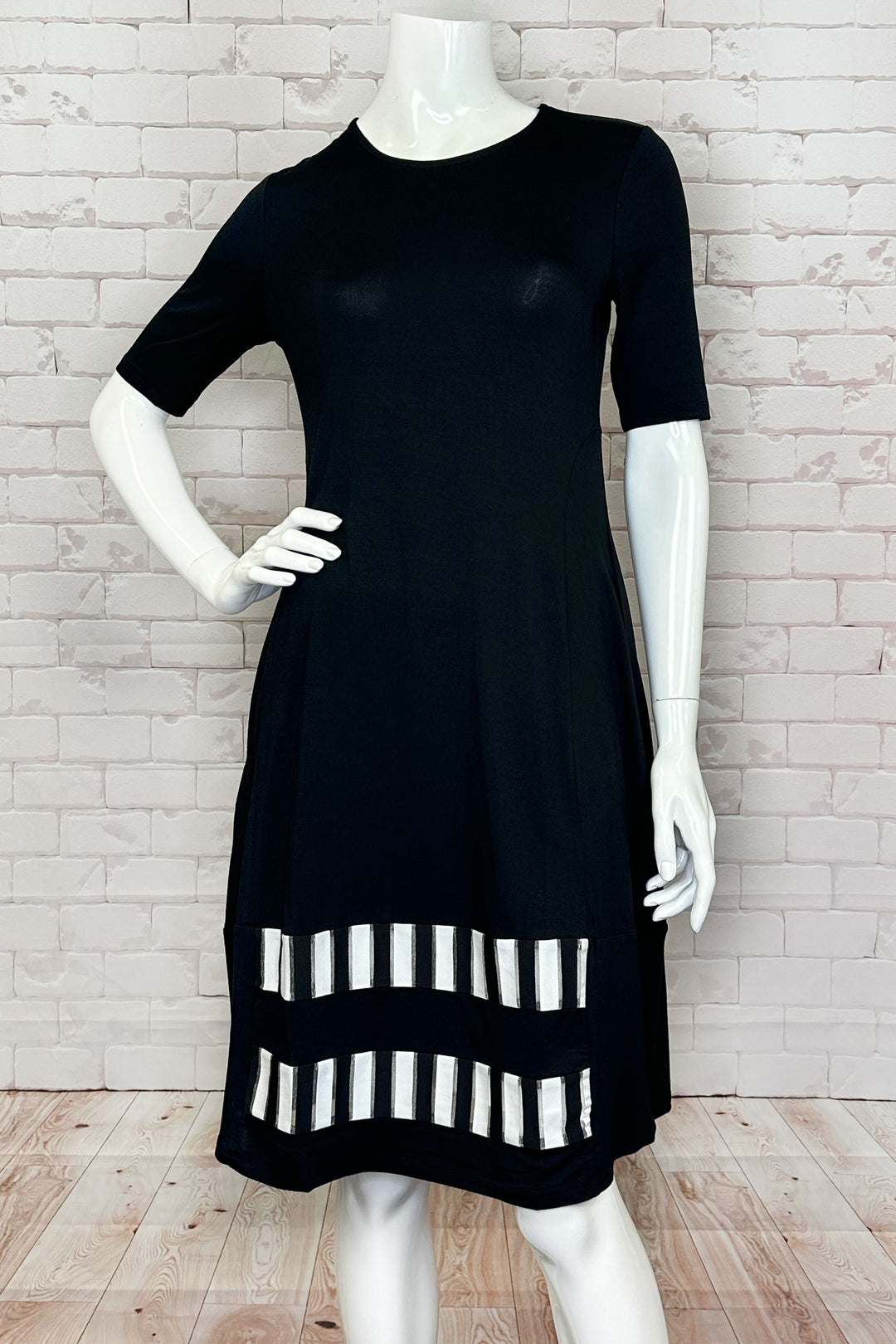 Ever Sassy Spring 2024 This chic dress features a round neckline, short sleeves and to the knees length.