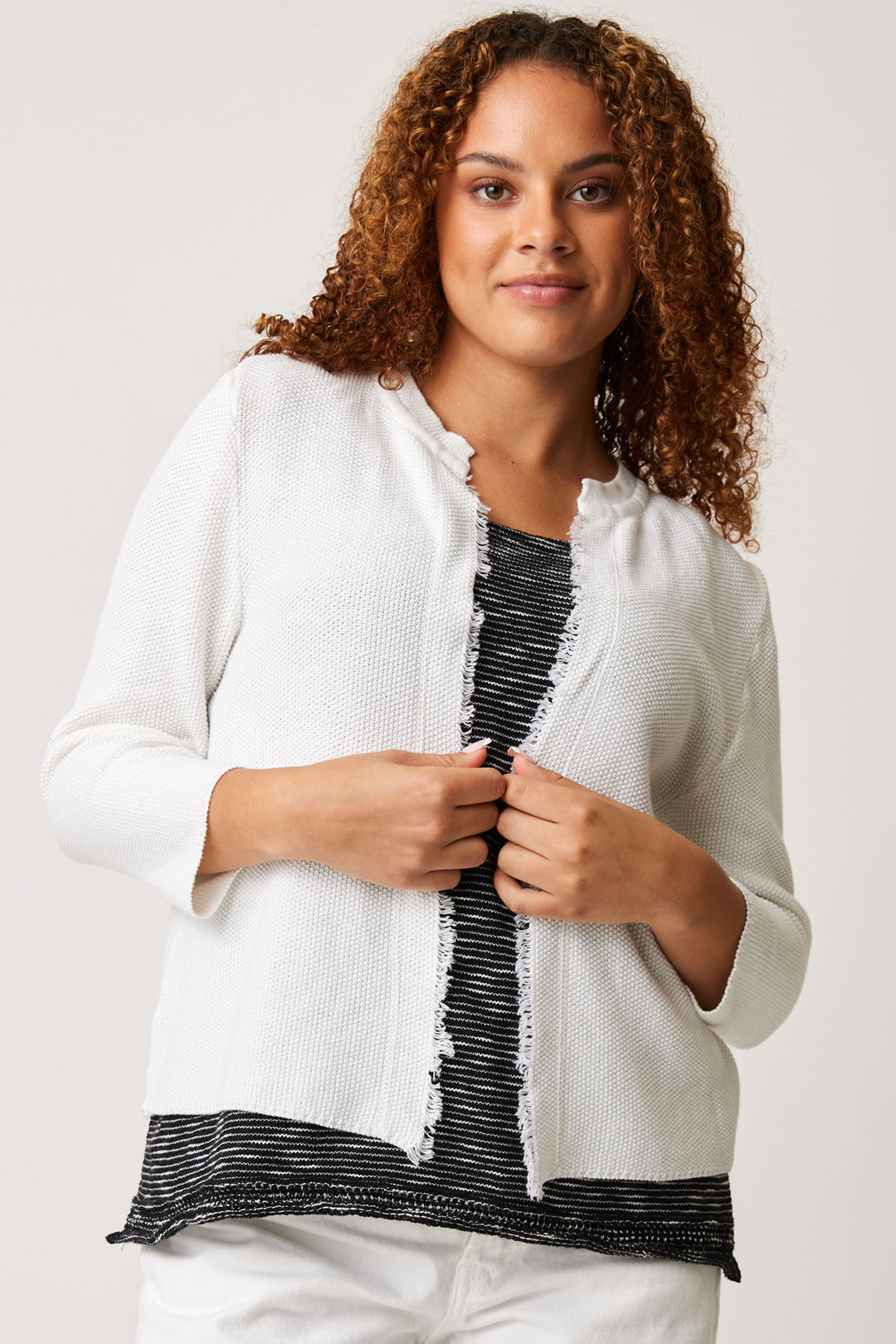 Cotton Country Spring 2024 This knit cotton cardigan boasts a sophisticated open style and delicate fringe detailing throughout the opening. 