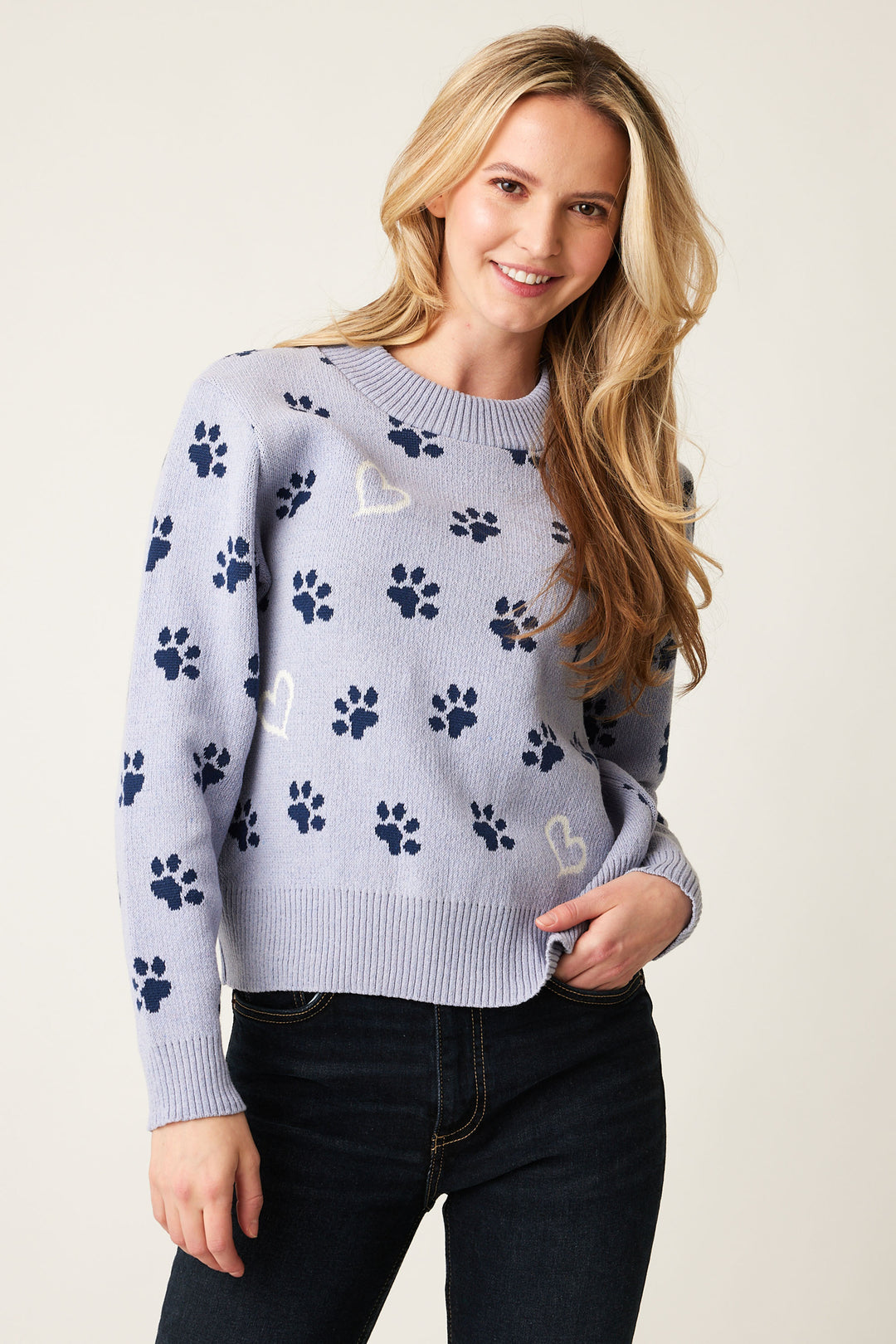 Cotton Country Fall 2024 The sweet paw prints and red hearts add a touch of whimsy to the thick knit sweater fabric. The ribbed cuffs, hem and neckline provide a snug fit, perfect for colder days.