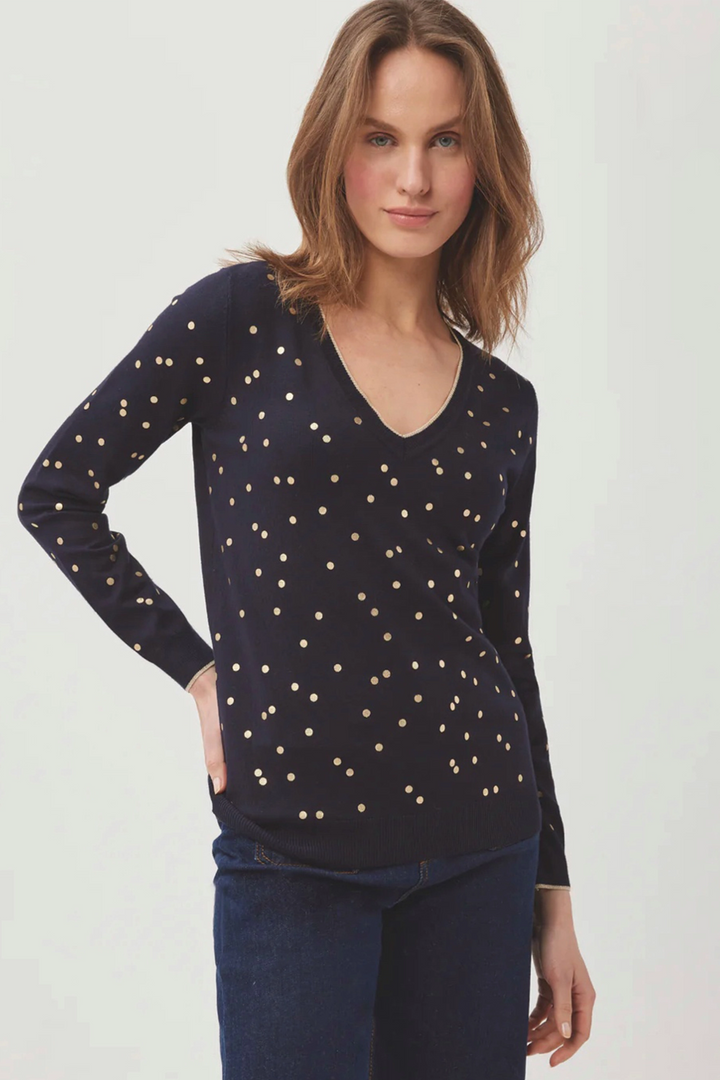 Sleek with a gold dot pattern all-over, this top is sure to glam you up! 