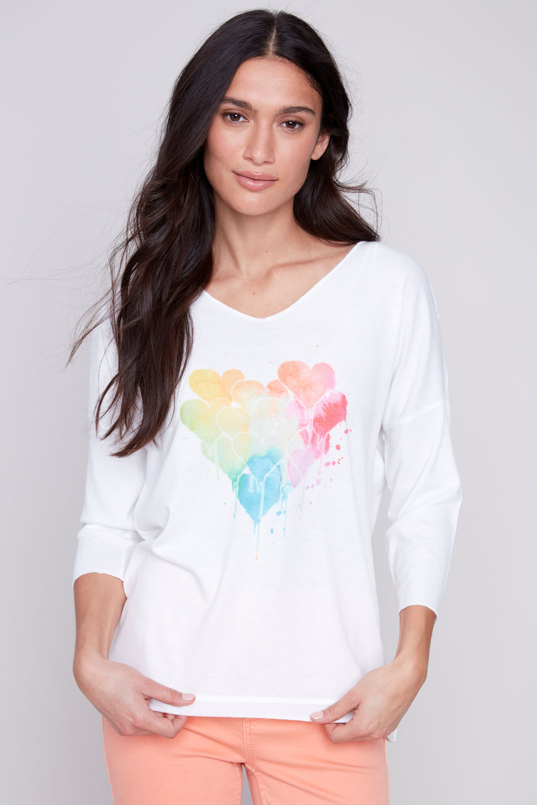 Charlie B Summer 2024 This effortless and comfortable multicolour top is the perfect addition for your summer wardrobe. It features a soft cut v-neck, relaxed fit and colourful hearts print.
