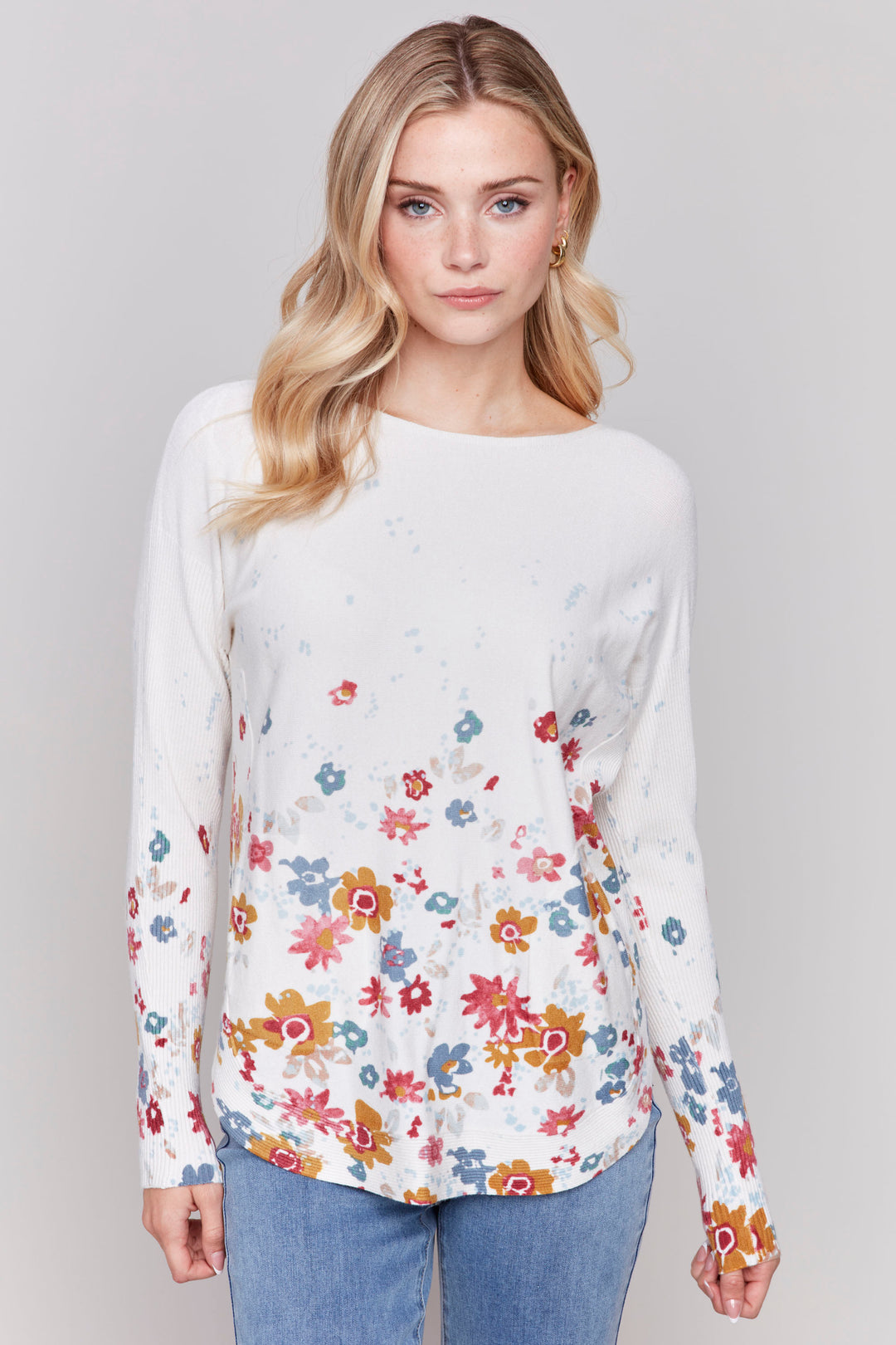 Charlie B Fall 2024  Made with super plush and soft fabric, this light sweater top features long loose ribbed sleeves for a cozy fit. The charming floral border print adds a touch of elegance. 