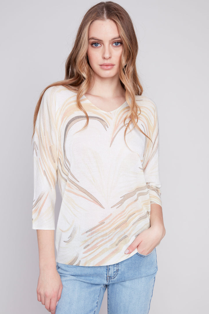 Featuring a soft cut v-neck and classic dolman sleeves, this charming heart print will add a playful touch to your wardrobe.