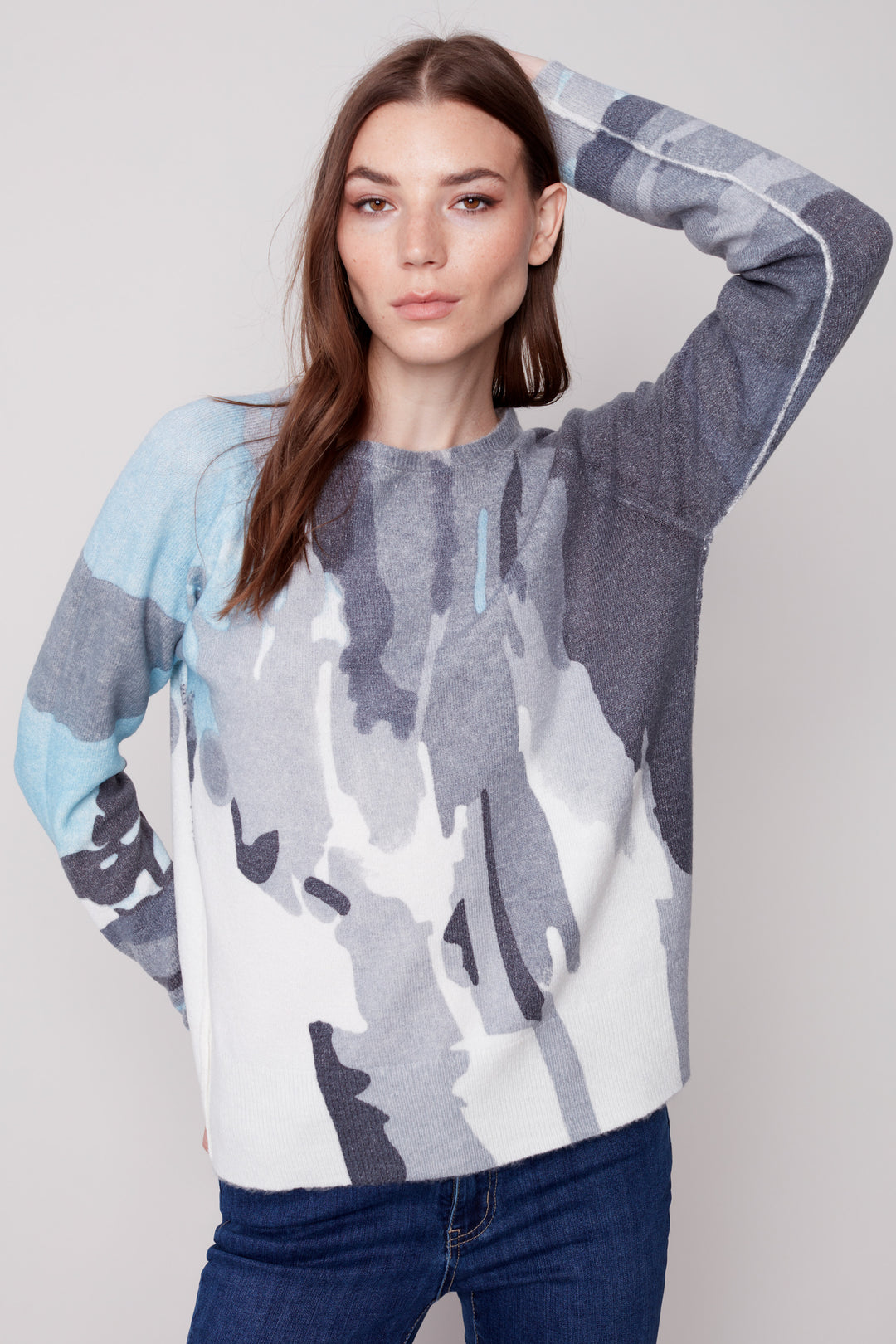  The printed crew neck sweater is designed with a crew-neck and raglan sleeve for a light, comfortable fit. With a reversible design, this sweater is perfect for any occasion.