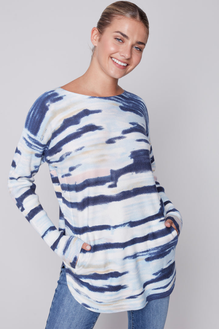 This Print Long Sleeve Top Sweater is made from a breathable blend of light-weight fabrics with a fashionable lace-up detail and two pockets. 