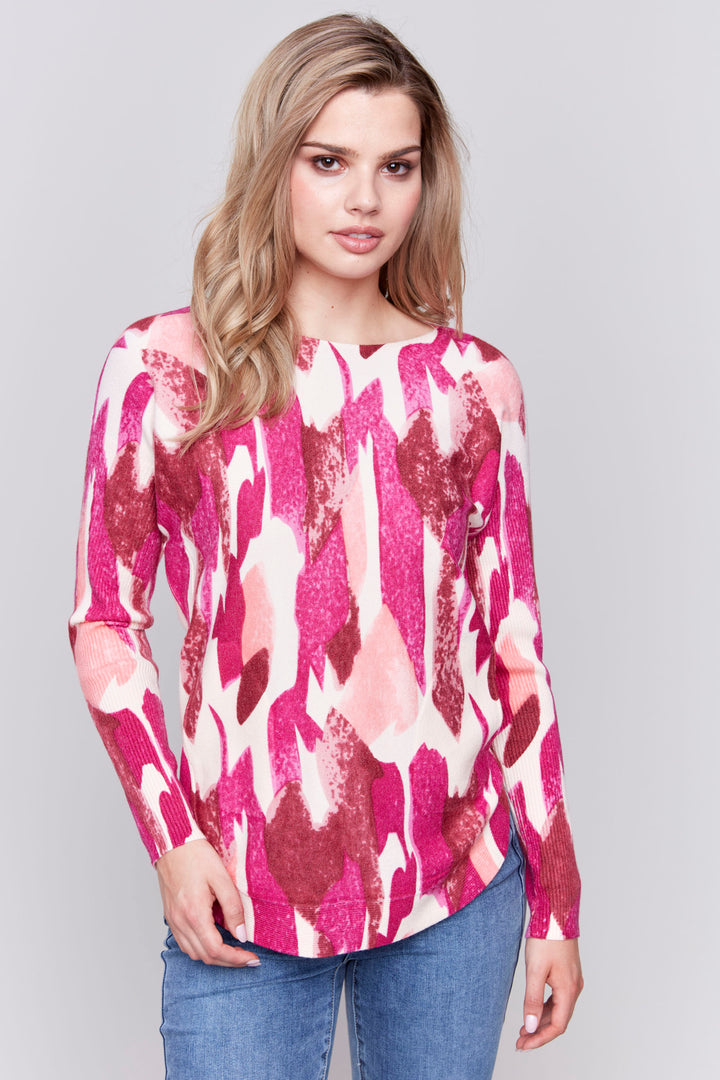 Charlie B Fall 2024 This Painted Camo Long Sleeve Top is made from plush knit fabric, giving you a comfortable and stylish look. 