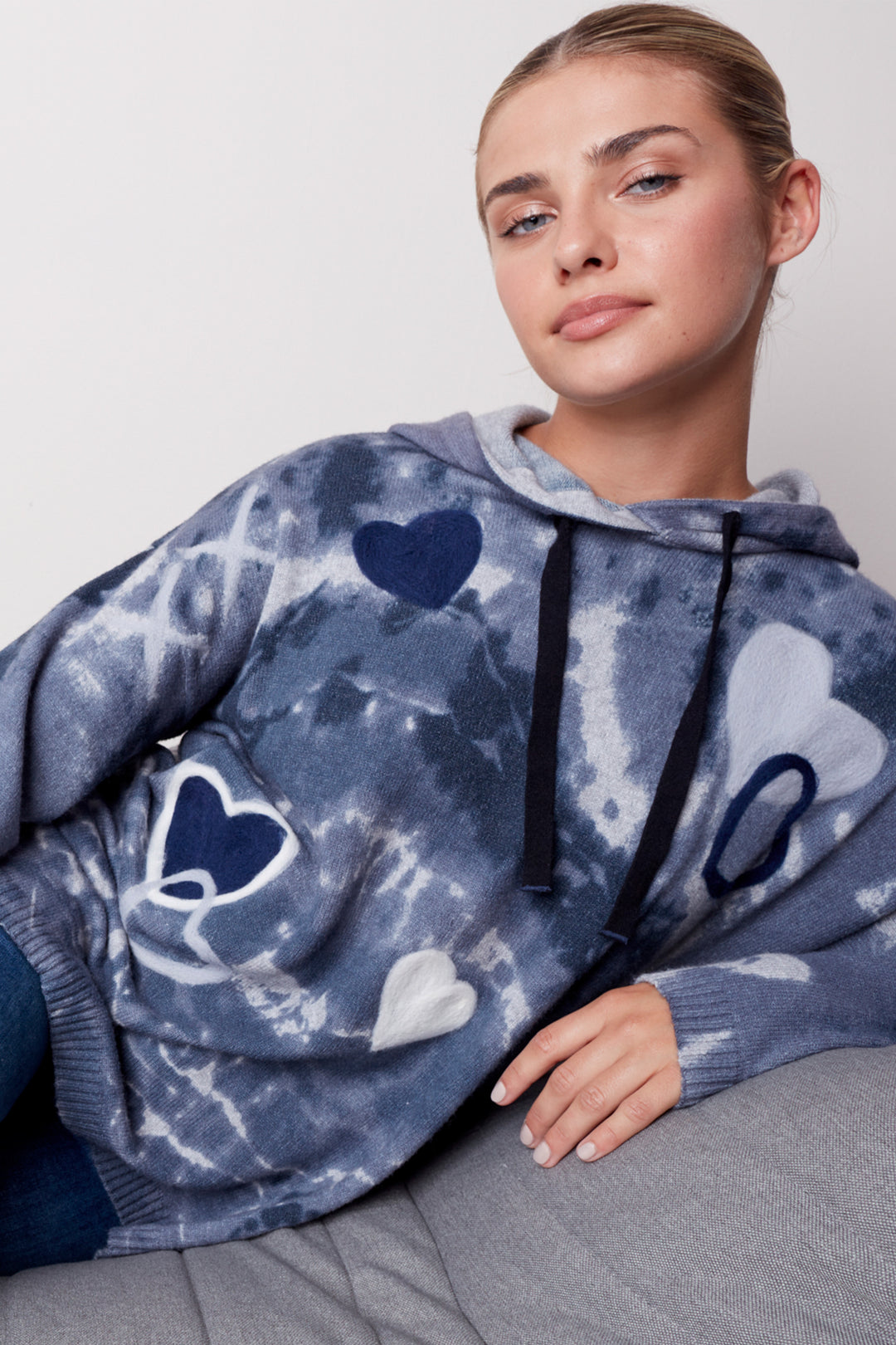 Feel the warmth and comfort of this Tiedye Hoodie Top with hearts. Its punch design graffiti and hearts print give it an eye-catching look.