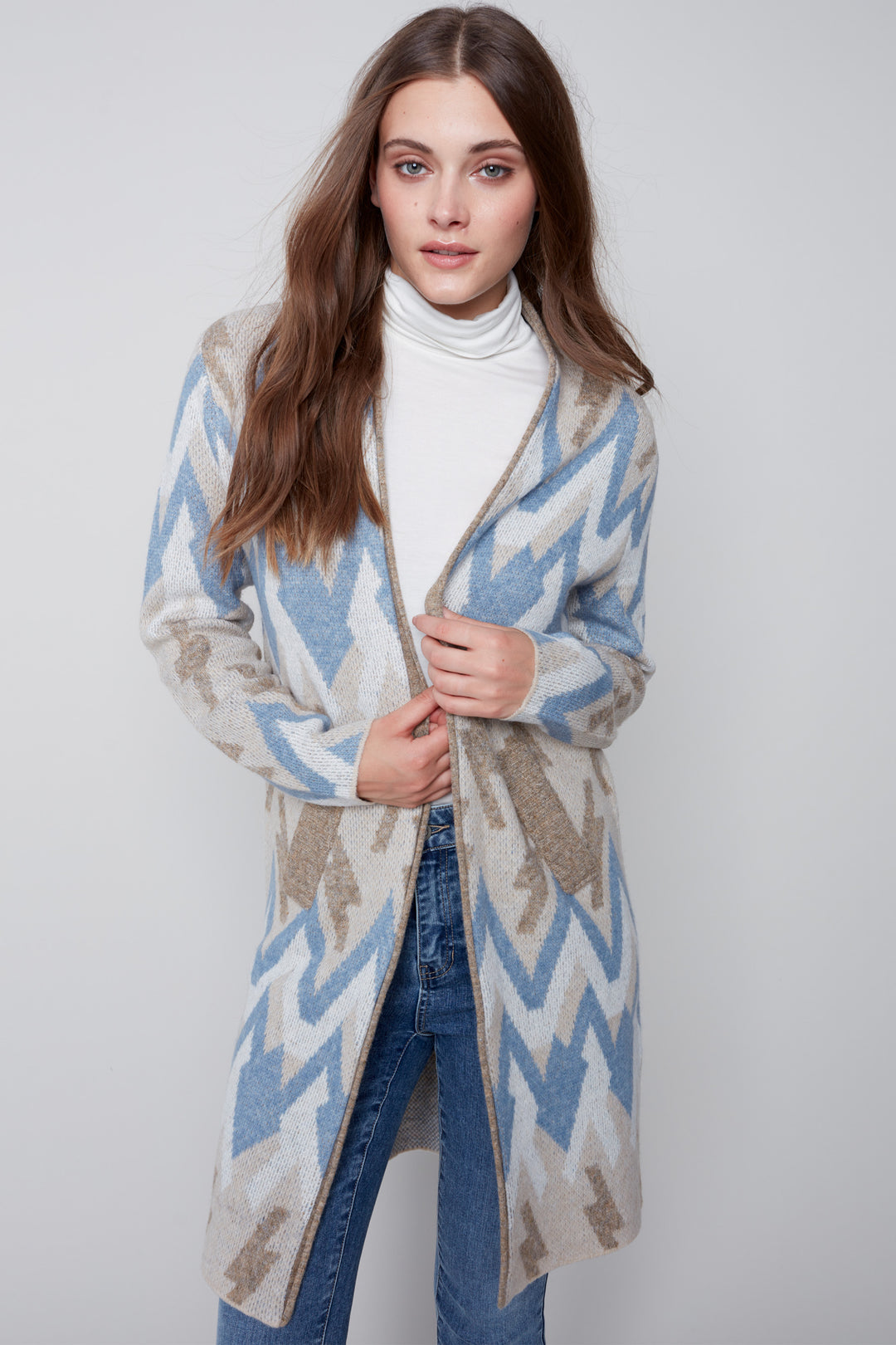 Step up your style this Fall with the Zigzag Print Cardigan, made from long Jacquard knit and featuring a fitted open cardigan with pocket. This versatile cardigan is accentuated with a light look mixed with soft autum colours, so you can make a fashion statement no matter where you are.